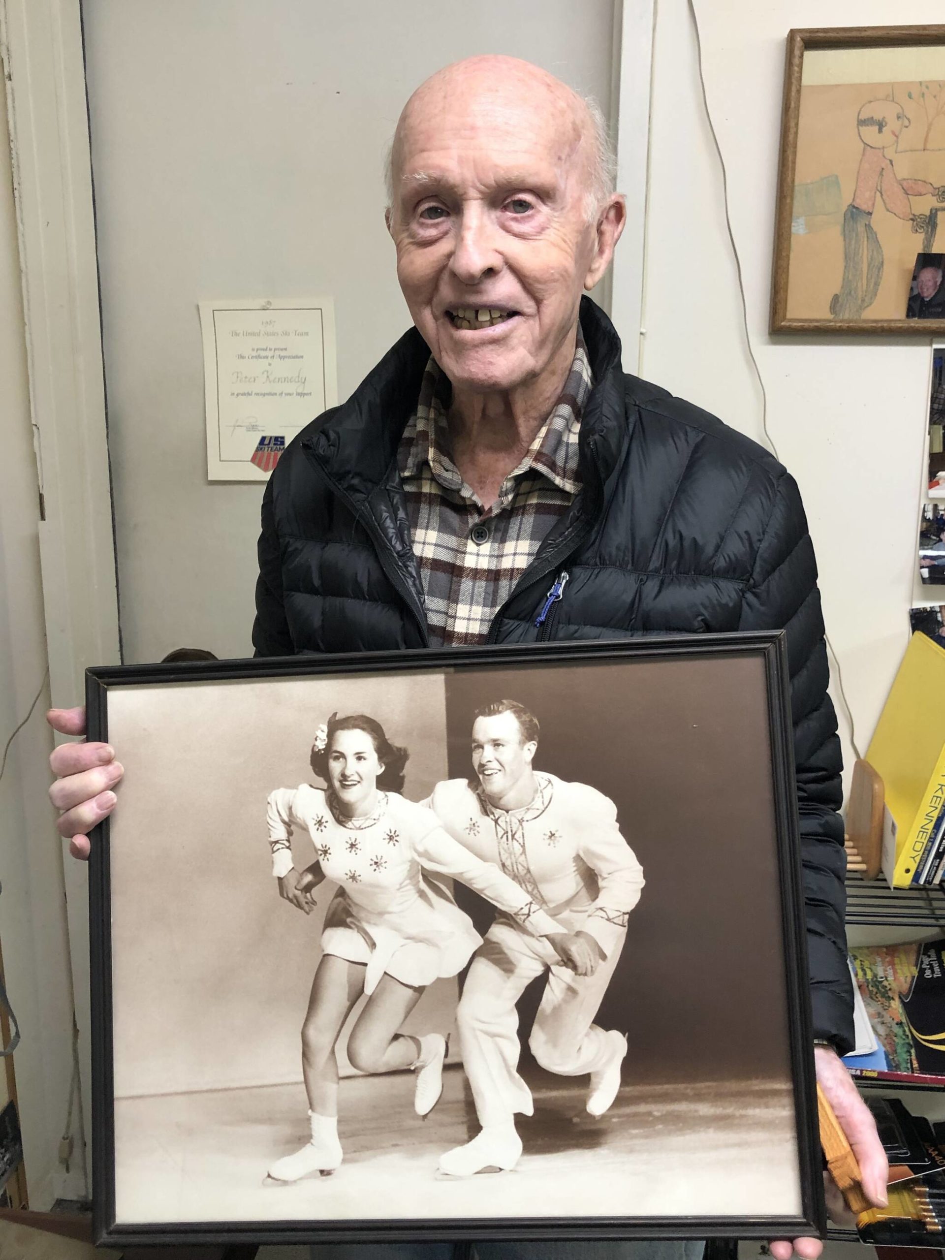 Peter Kennedy displays a photo of him and his sister Karol, who were the pairs figure skating silver medalists at the 1952 Winter Games in Oslo. Courtesy photo
