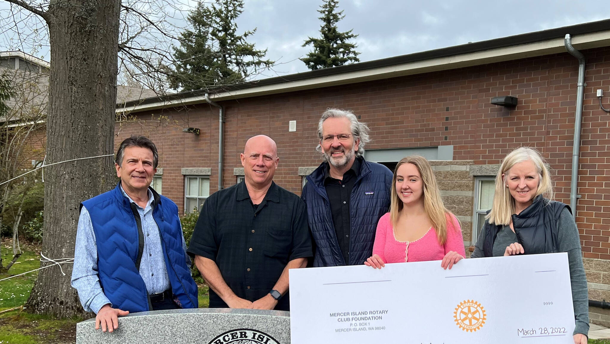 From left to right, David Thompson, treasurer of the Mercer Island Rotary Club Foundation; Wally Boos, chair of the Mercer Island Rotary Club Scholarship committee; Victor Raisys, father of Vaiva Raisys, Mercer Island High School senior and Mercer Island Rotary Club Scholarship recipient; and Laurie Raisys, mother. Courtesy photo