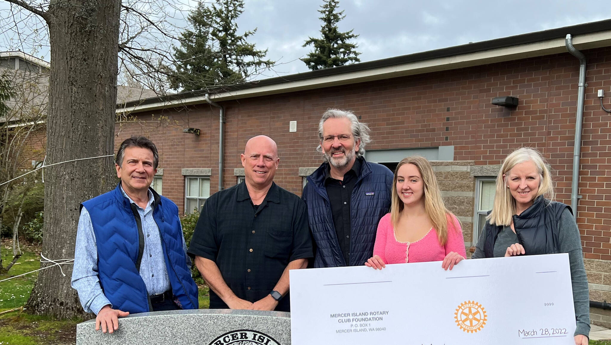 From left to right, David Thompson, treasurer of the Mercer Island Rotary Club Foundation; Wally Boos, chair of the Mercer Island Rotary Club Scholarship committee; Victor Raisys, father of Vaiva Raisys, Mercer Island High School senior and Mercer Island Rotary Club Scholarship recipient; and Laurie Raisys, mother. Courtesy photo