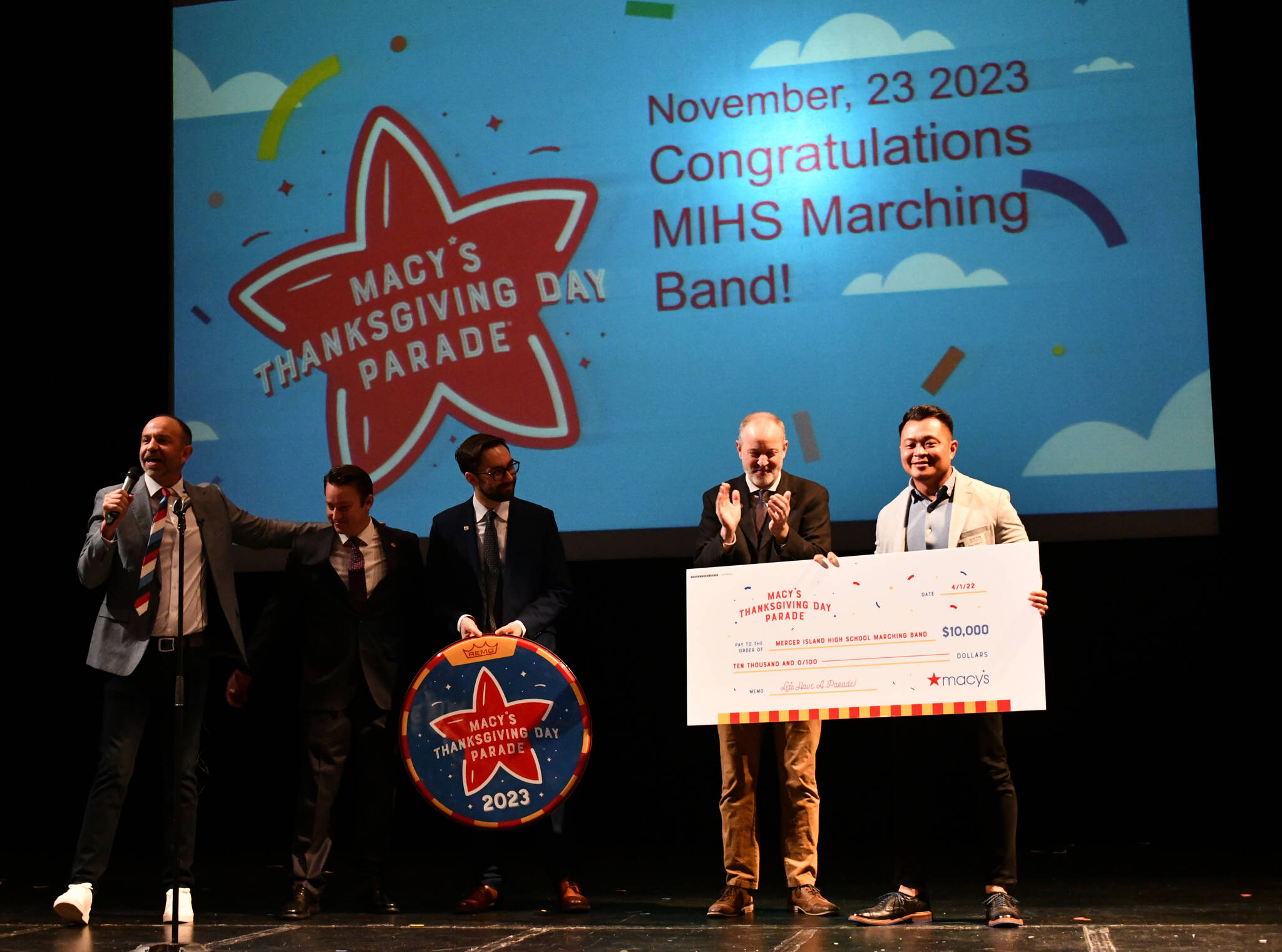 Pictured from left to right on April 1 at Mercer Island High School, Macy’s Thanksgiving Day Parade creative producer Wesley Whatley, Mercer Island High School marching band directors Kyle Thompson, Jacob Krieger and Parker Bixby and Macy’s Bellevue store manager Ryan Ramoso. Andy Nystrom/ staff photo