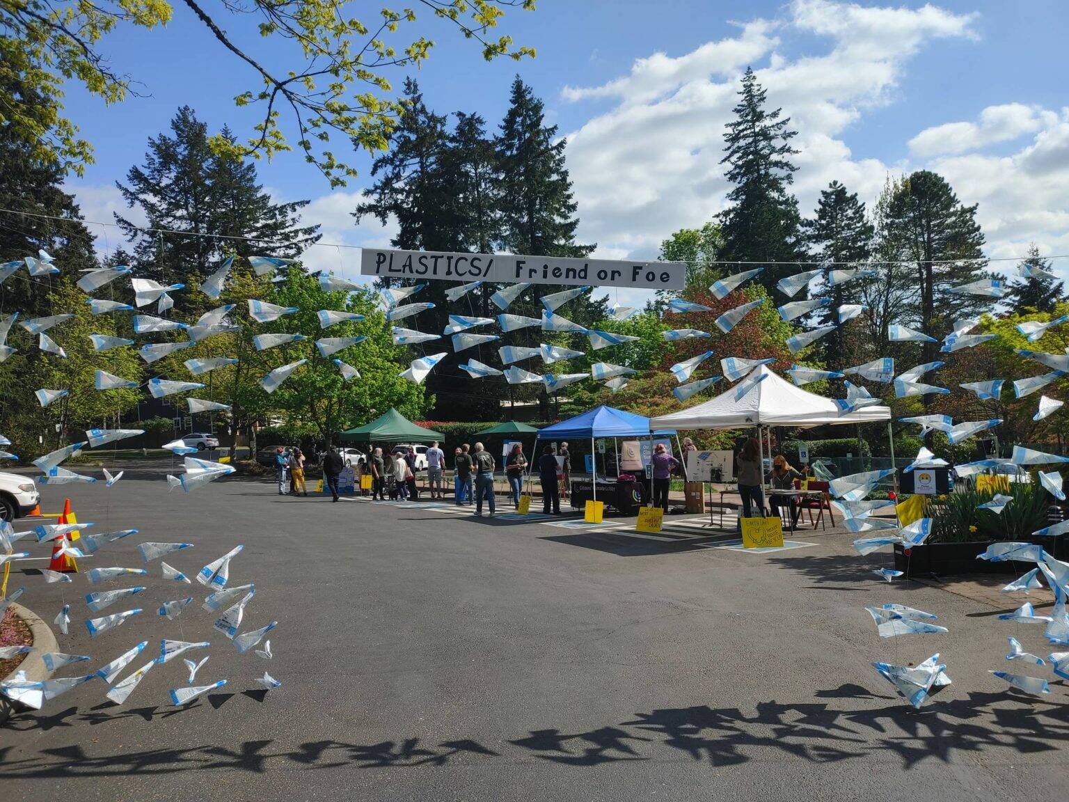 A drive-through art installation made of recycled materials points the way toward the Congregational Church on Mercer Island Earth Day Fair in 2021. Reporter file photo