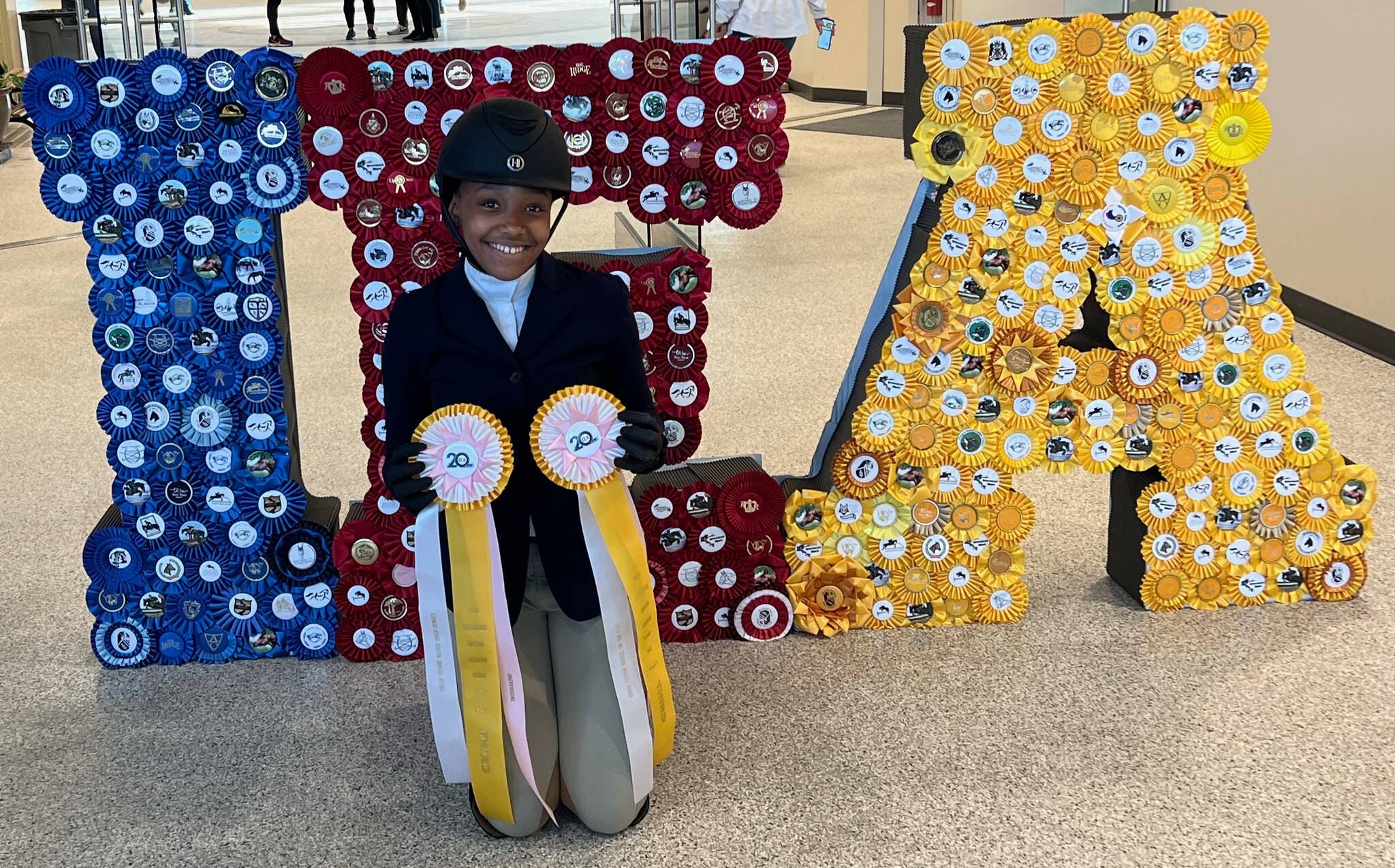 Mercer Island’s Gabby Frederick displays her third-place ribbons at the Interscholastic Equestrian Association National Competition, which took place from April 27-May 2 in Harrisburg, Pennsylvania. Courtesy photo