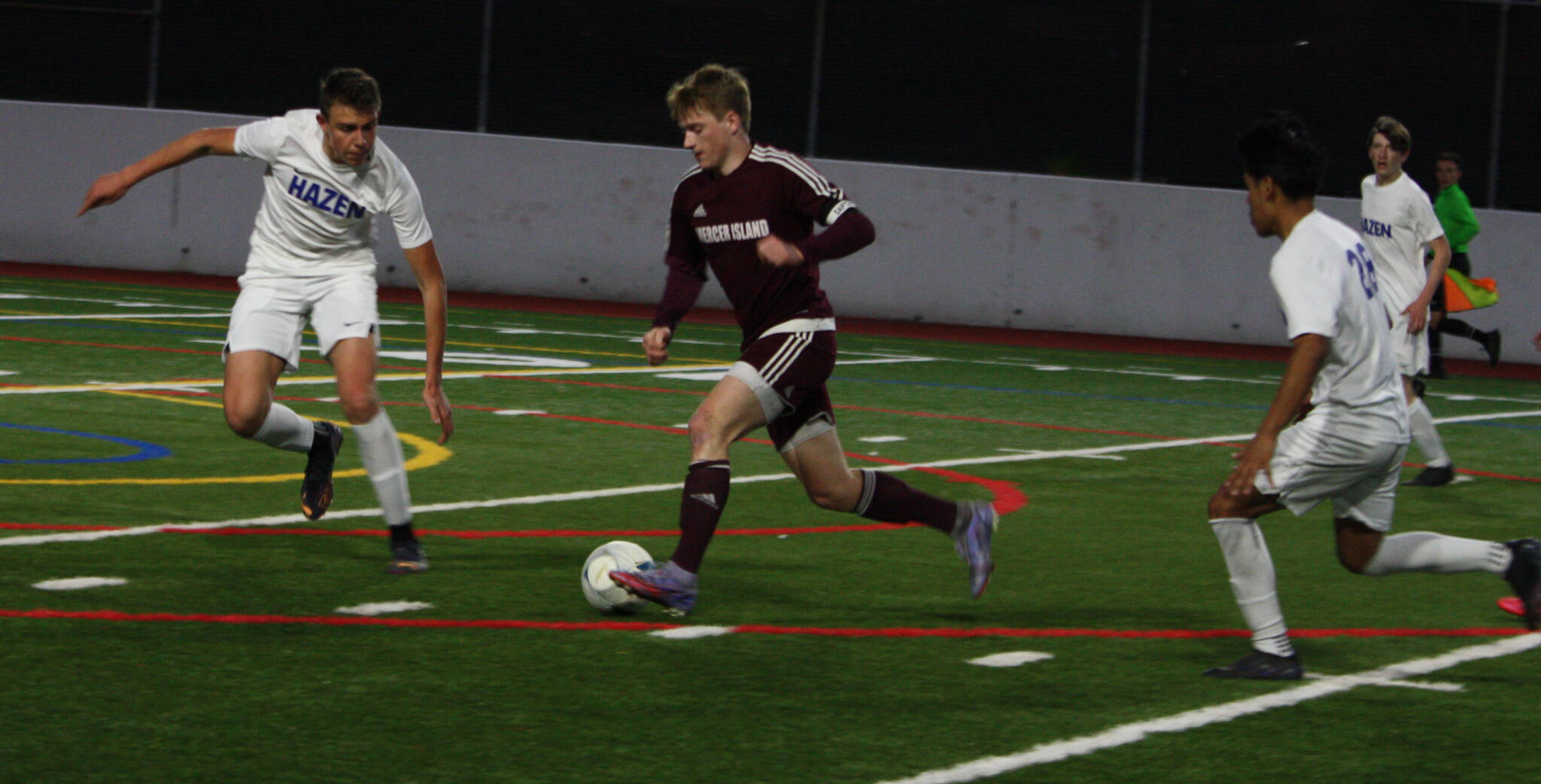 Mercer Island’s Hawkins Sanborn takes on some Hazen defenders. Andy Nystrom/ staff photo