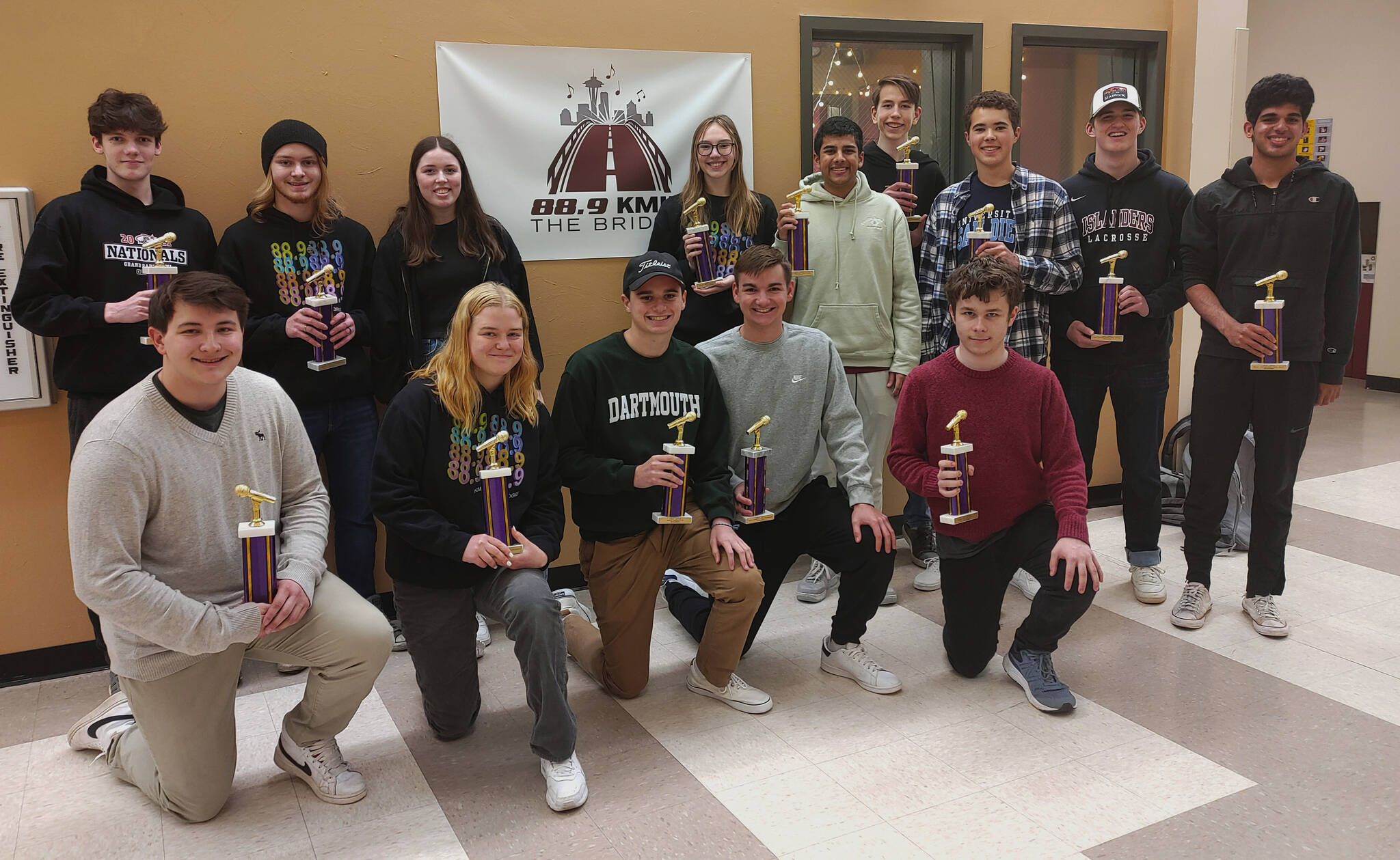 A host of Mercer Island High School KMIH 88.9 The Bridge victors in the 82nd annual Intercollegiate Broadcasting System awards. Left to right, front row: Nick Neyhart, Audrey Sadlier, Gabe Gottesman, Scott Pirak and Theodore Freeman. Back row: Will Pellerin, Jackson Hegarty, Annabelle Hegarty, Sadie Jensen, Ajay Manhas, Jonathan Aggar, Gill MacDonald, Dylan Shobe and Azad Khan. Andy Nystrom/ staff photo