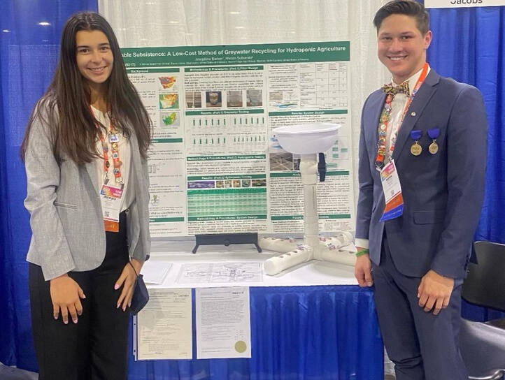 Mercer Island’s Josephine Barber, left, stands with Mason Sufnarski of Waxhaw, North Carolina, while displaying their project, “Sustainable Subsistence: A Low-Cost Method of Greywater Recycling for Hydroponic Agriculture,” at the Regeneron International Science and Engineering Fair in Atlanta, Georgia. Courtesy photo