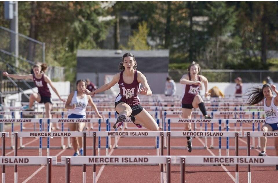 Mercer Island High School junior Ari Nguyen, middle, attacks the hurdles during a 3A KingCo race this season. She finished fourth and fifth in the 3A state 100 and 300 hurdles, respectively, in May. Courtesy of Jamie Mitchell