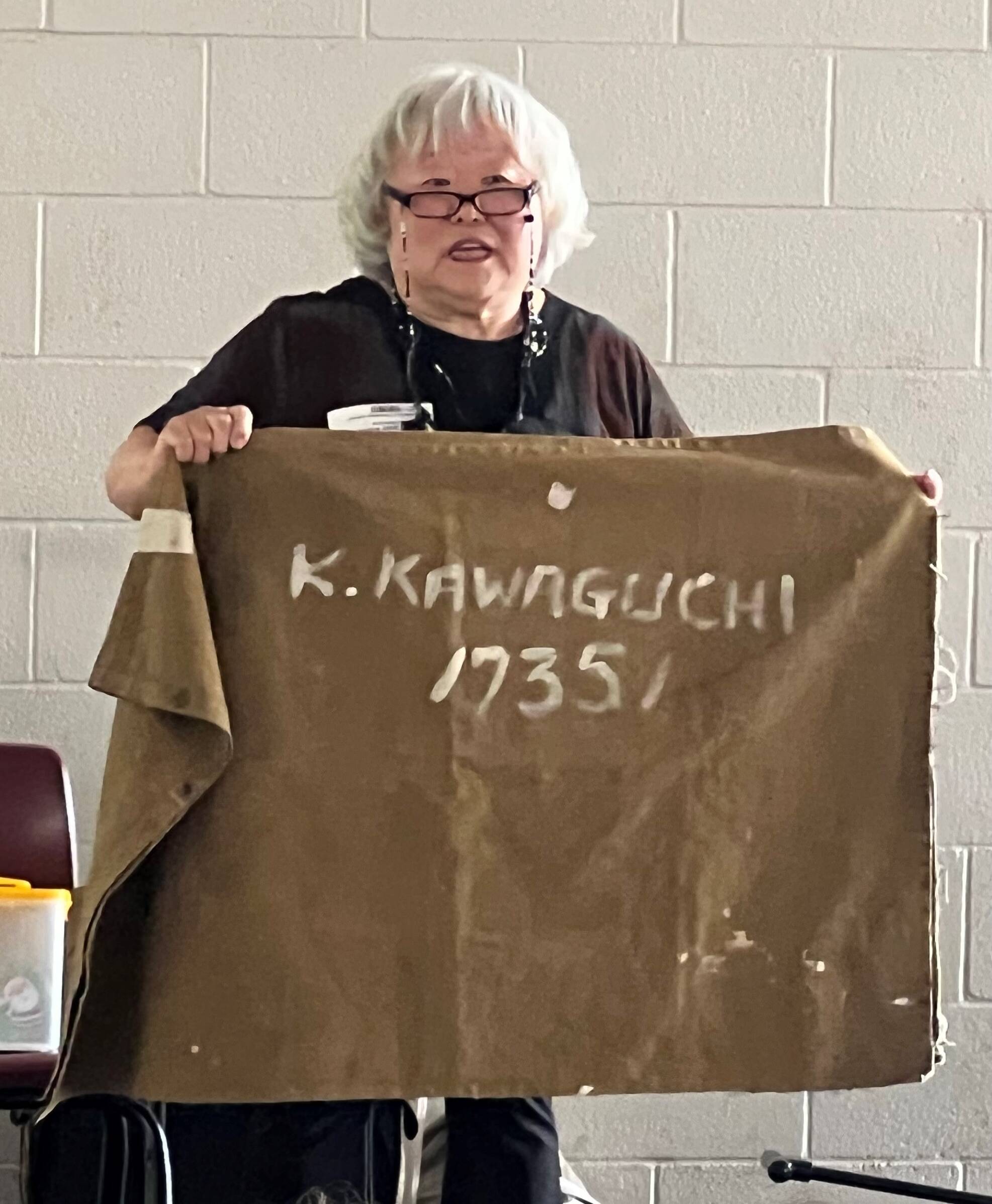 Judy Kusakabe showing West Mercer Elementary 4th graders her family gunny sack, where they had to place their belongings when they were sent to the prison camp. Photos by Soyun Chow