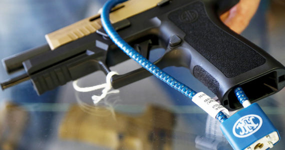A semiautomatic handgun with a safety cable lock that prevents loading ammunition. (Sound Publishing file photo)