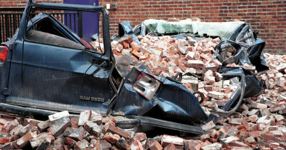 A large van was crushed by earthquake debris in a Seattle parking lot in this photo taken March 4, 2001. FEMA News Photo by Kevin Galvin
