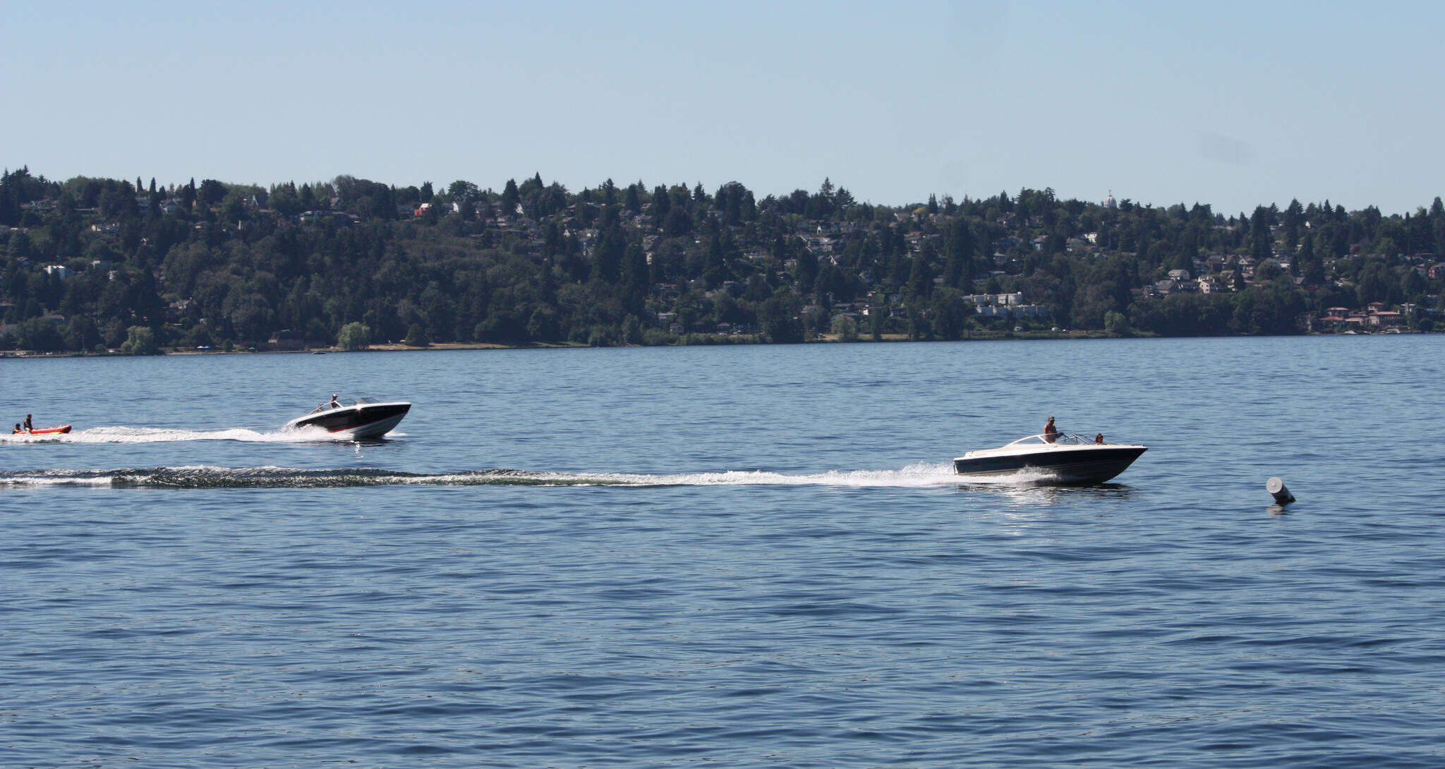 Boaters cruise by the Roanoke Dock area on Lake Washington on a recent afternoon. Andy Nystrom/ staff photo