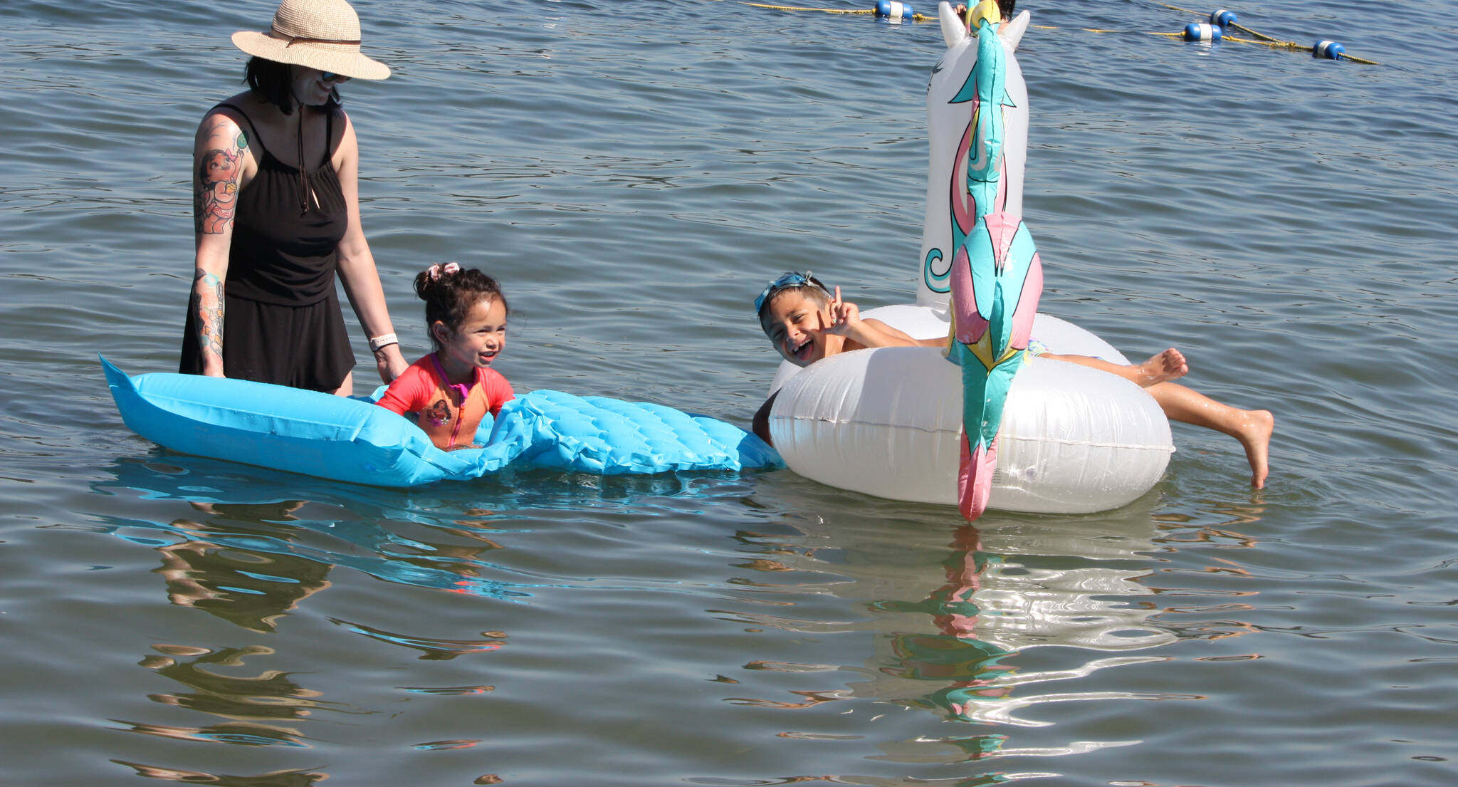 Naomi Nabura plays with her children Sonia, 3, and Theo, 6, in Lake Washington off Luther Burbank Park during the scorching 90-degree temperatures on July 26. Naomi is a former Island resident. Andy Nystrom/ staff photo