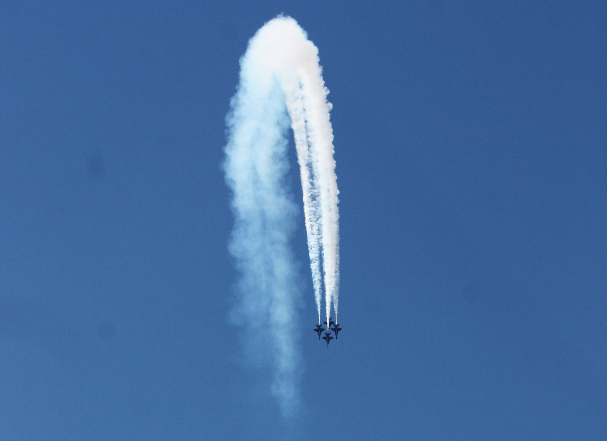 The U.S. Navy Blue Angels soar through the air on Sunday in this photo taken from the Groveland Beach Park pier. Andy Nystrom/ staff photo