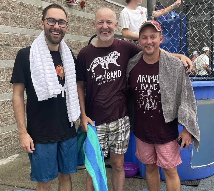 Mercer Island band directors, from left to right, Jacob Krieger, Parker Bixby and Kyle Thompson gather after their dunk tank session on Aug. 18. Courtesy photo