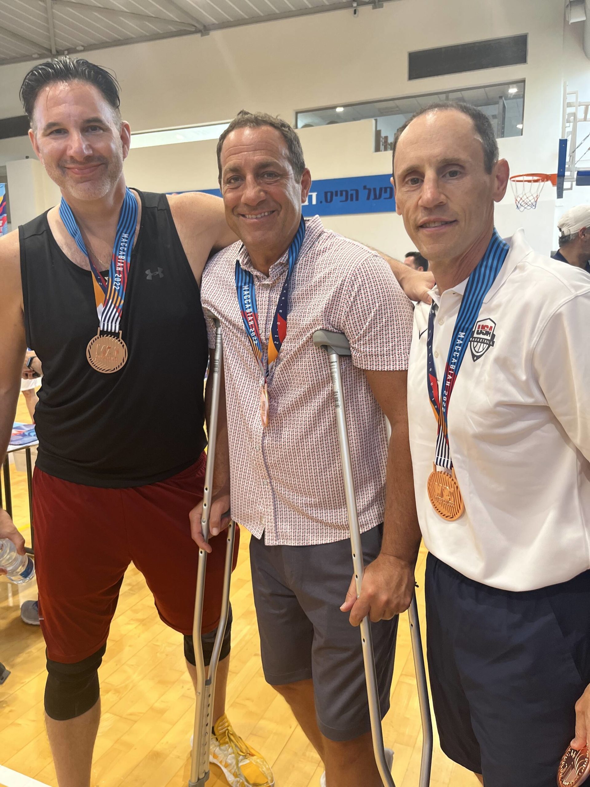 From left to right: Charlie Barokas, Al Moscatel and Glen Coblens gather after the awards ceremonies at last month’s 2022 Maccabiah Games in Israel. Photo courtesy of Mia Birk