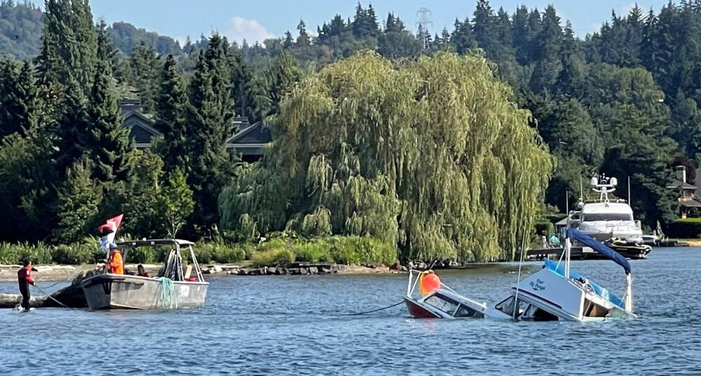 An unoccupied, partially submerged vessel is secured in Lake Washington near the Mercer Island shoreline on Aug. 31. Photo courtesy of the city of Mercer Island