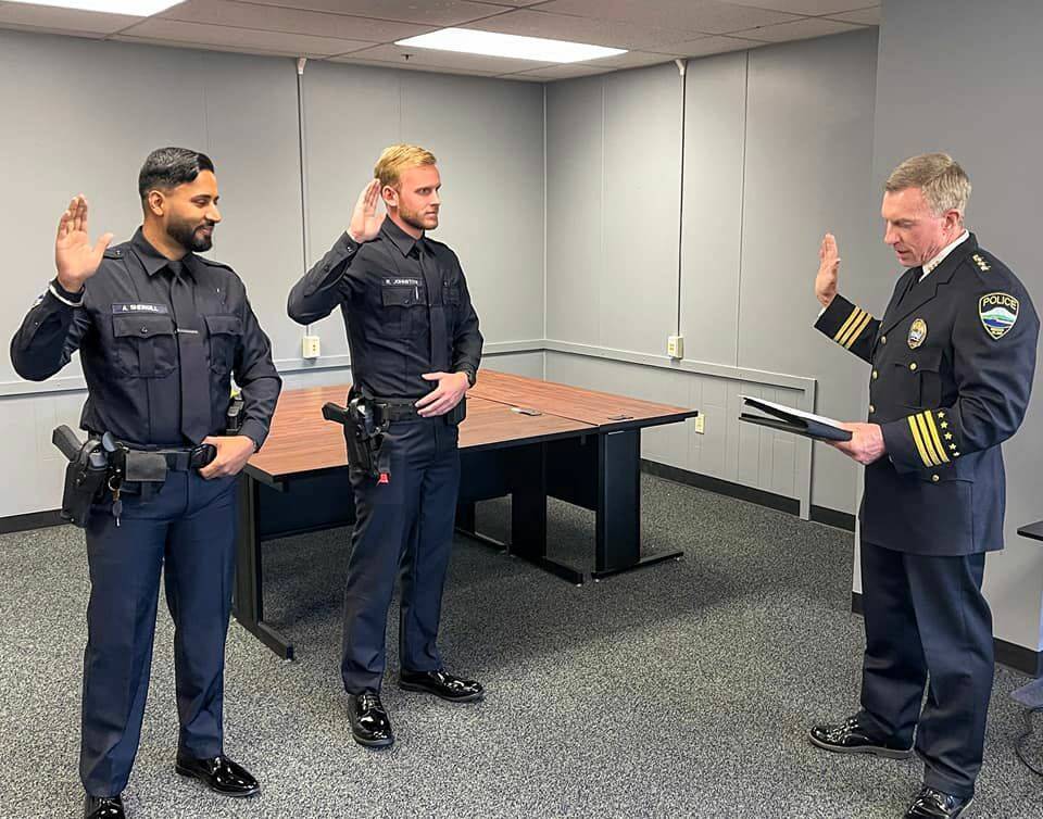 Officers Amandeep Shergill (left) and Reid Johnston (center) are the newest members of the Mercer Island Police Department force. They will now begin a three-month Field Training Officer (FTO) program where they will ride with, and learn from, several veteran officers. According to Chief Ed Holmes (right), when a new officer has successfully completed the FTO phase of their training, a patrol sergeant will serve as their mentor while they complete their probationary period. Photo courtesy of the Mercer Island Police Department