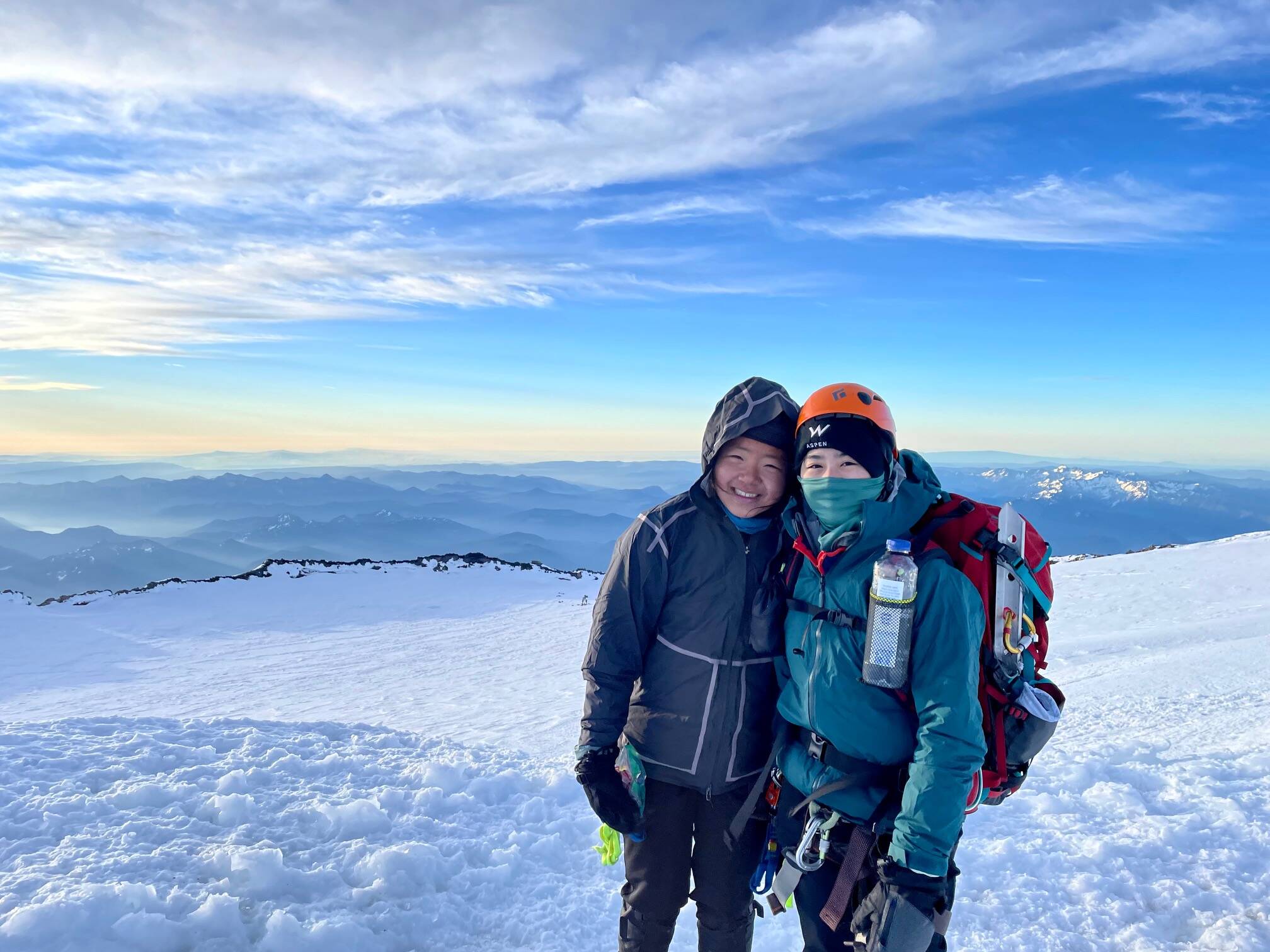 Mercer Island scouts Amelia Han and Lexi Liu stand atop Mount Rainier after they summited the stratovolcano and highest mountain in Washington state in late July. Courtesy photo
