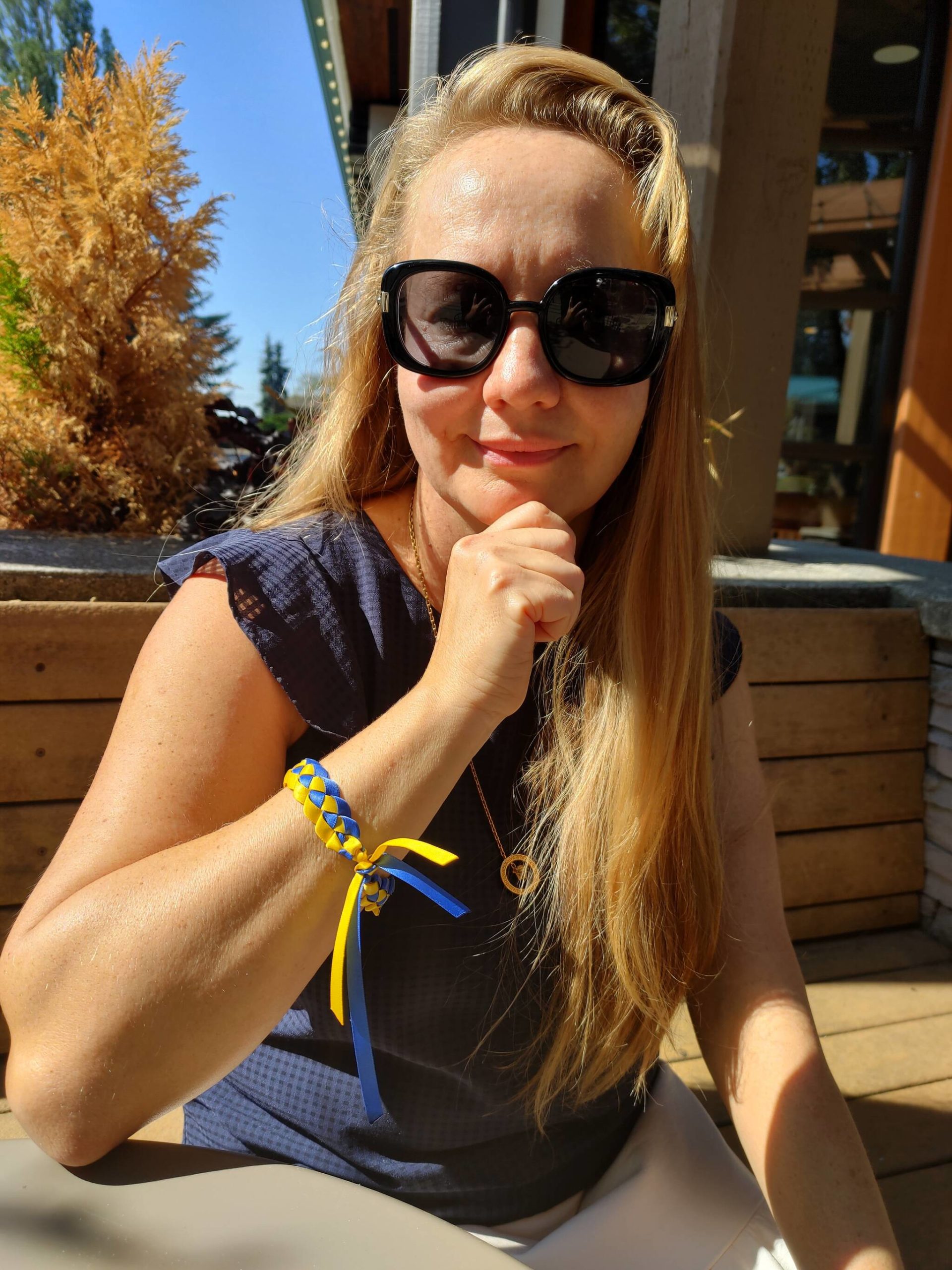 Nataliya Bobrovnyk sports a bracelet with blue and gold ribbons intertwined that signify the national colors of her native Ukraine. Andy Nystrom/ staff photo