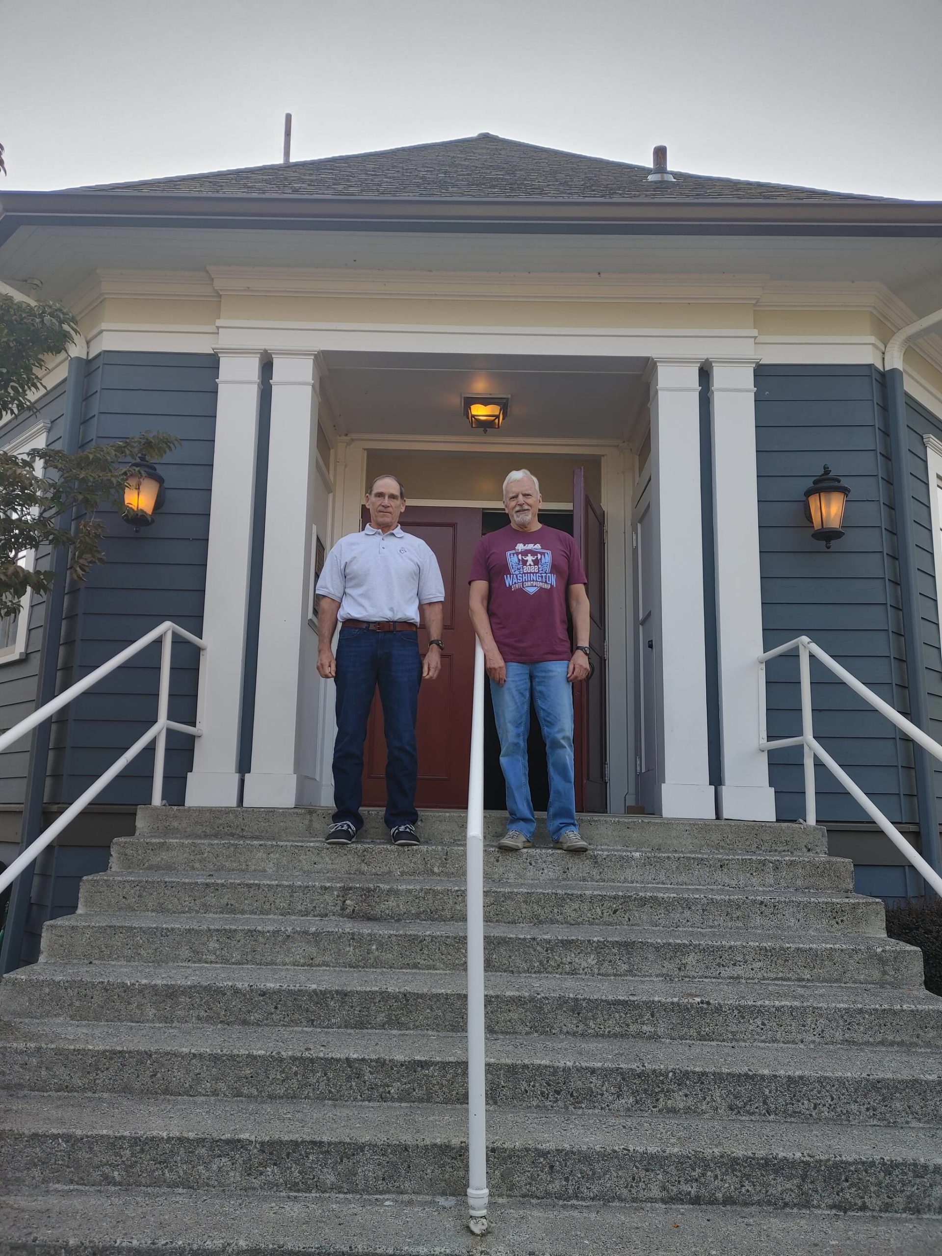 From left, Mercer Island VFW Post 5760 members Thomas Koger and Bob Harper stand outside the post’s historic building. The structure was officially opened and dedicated on Oct. 21, 1922. Andy Nystrom/ staff photo
