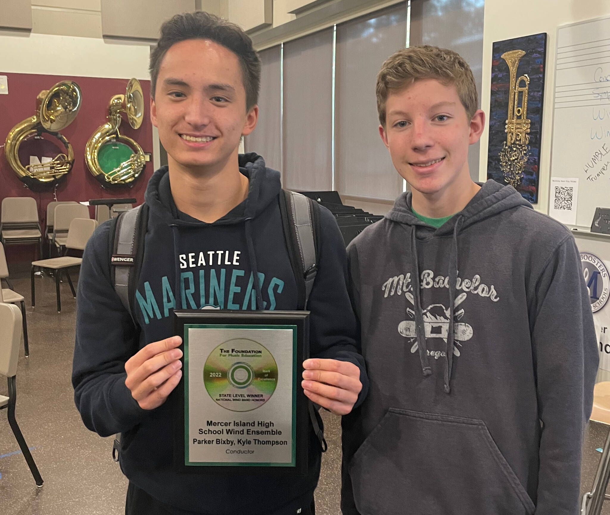 From left, Mercer Island High School wind ensemble trumpeters senior Sam Hill and junior Cameron Selby display the 2021-22 state level first-place award in the Mark of Excellence/National Wind Band Honors Project sponsored by The Foundation for Music Education. Photo courtesy of the Mercer Island School District