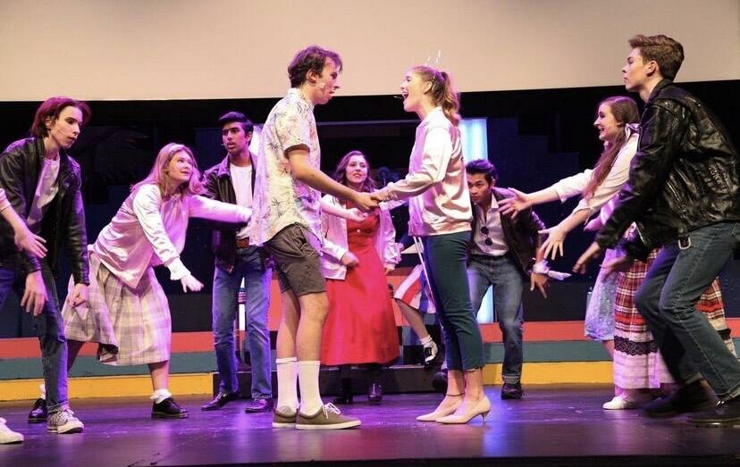 Mercer Island High School “Grease” cast members roll through a dress rehearsal. Photo courtesy of Greg Chvany