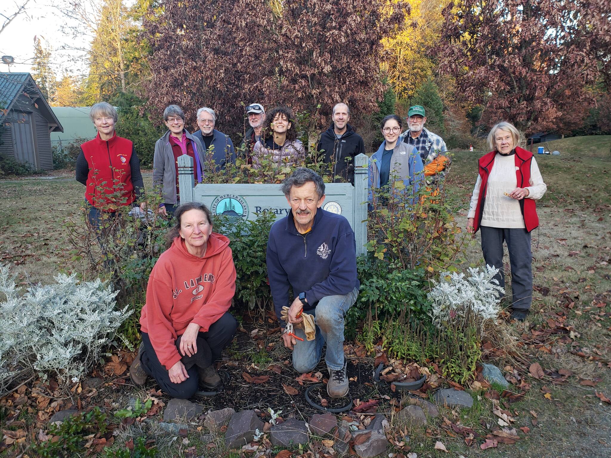 About 10 Rotary Club of Mercer Island members pulled ivy and blackberries during a two-hour cleanup gathering at Rotary Park on Nov. 19. The city parks staff provided gloves, tools, water and snacks for the volunteers. Pictured are: back row, from left, Pat Turner, Edie Warner, Mike Finn, John Hamer, Jordan Fischer (city staff), Rick Newell, Sally Dorer (Mercer Island High School student), John Howe and Vyvienne Stumbles; front, kneeling, Jenny McCloskey and Bob Ellis. Not pictured: Brad Judy and Terry Lee. Photo courtesy of John Hamer