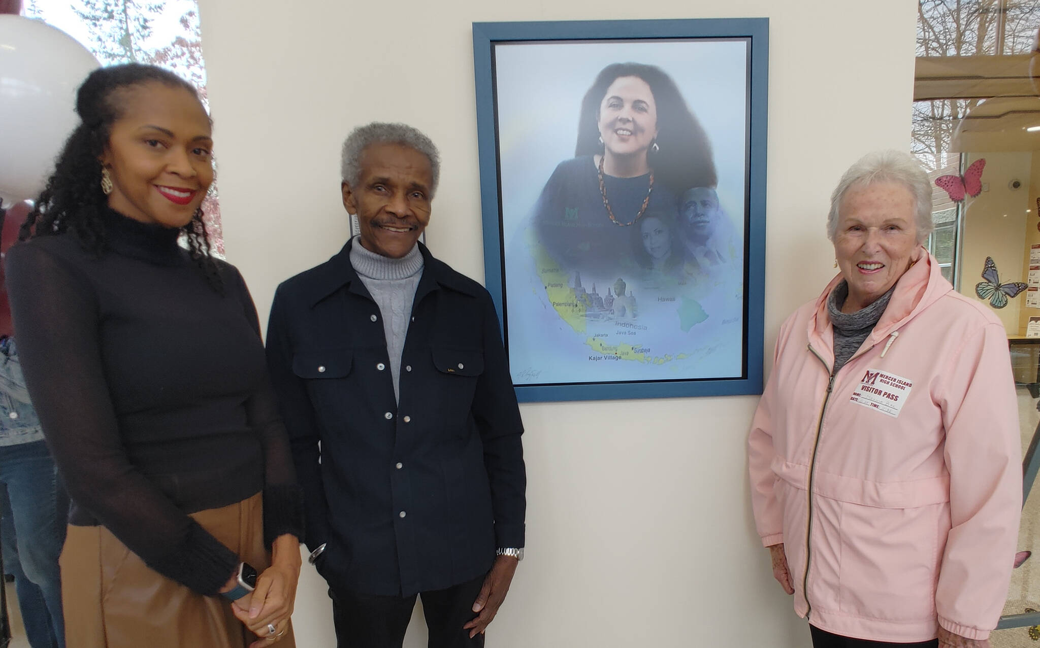 Pictured are Michelle Flowers-Taylor, artist Al Doggett and Maxine Box, Stanley Ann Dunham’s classmate at Mercer Island High School. Doggett’s portrait of Dr. Dunham prominently hangs on a wall in the school foyer. Andy Nystrom/ staff photo