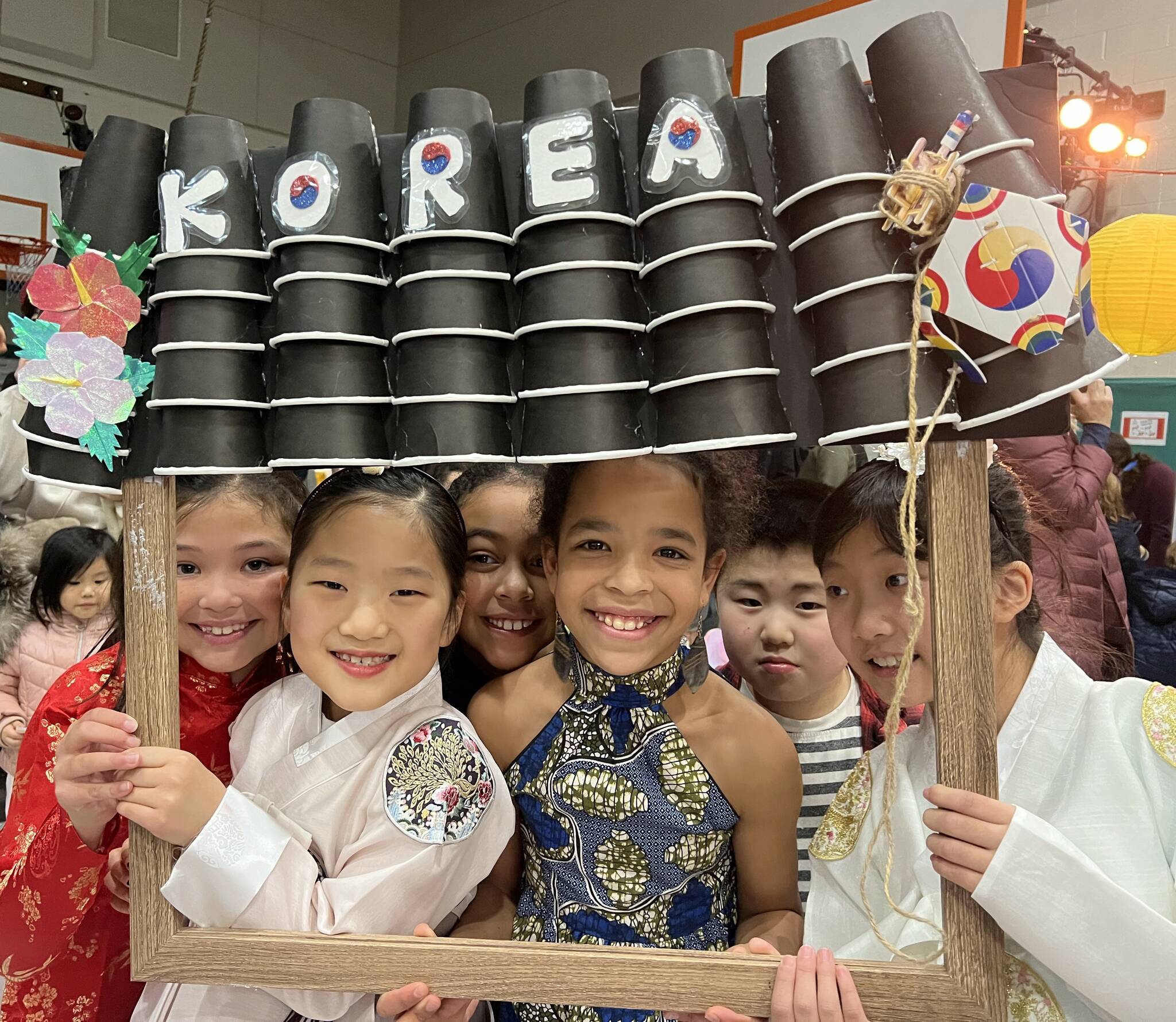 Students join together for a photo at the Korean family table. (Photos courtesy of Soyun Chow)