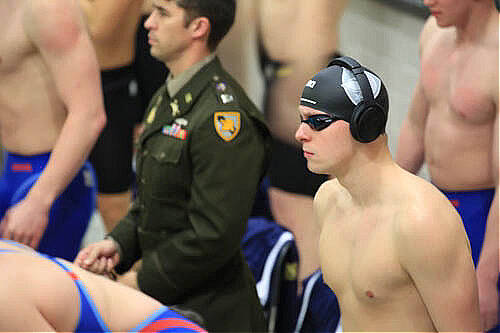Mercer Island resident and Army West Point sophomore Alex Edwards (right) displays intensity before his record-setting swim in the 100-yard backstroke at the 2022 Army-Navy dual swim meet on Dec. 2. Photo courtesy of Sarah Edwards