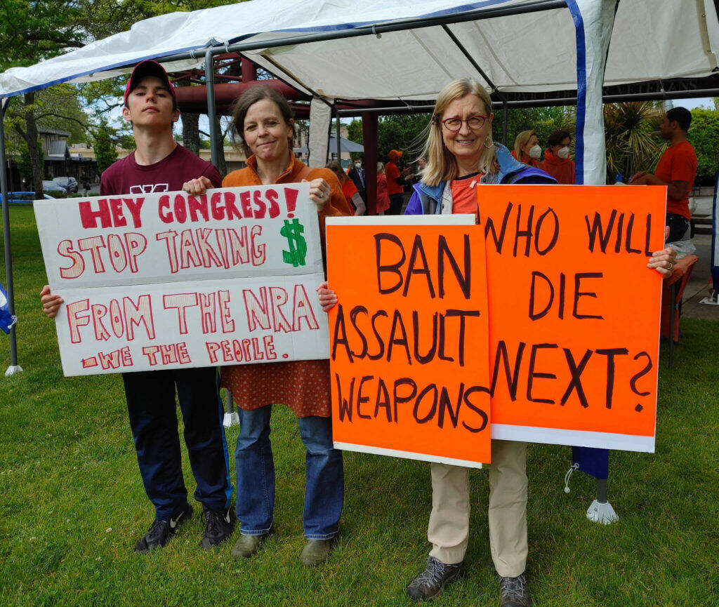 Andy Nystrom/ staff photo
From left to right, Ben Murawski, Judith Anderson and Caroline Haessly brought end gun violence signs to the Mercer Island PTA Committee on Gun Violence Prevention gathering on June 3 at Mercerdale Park.