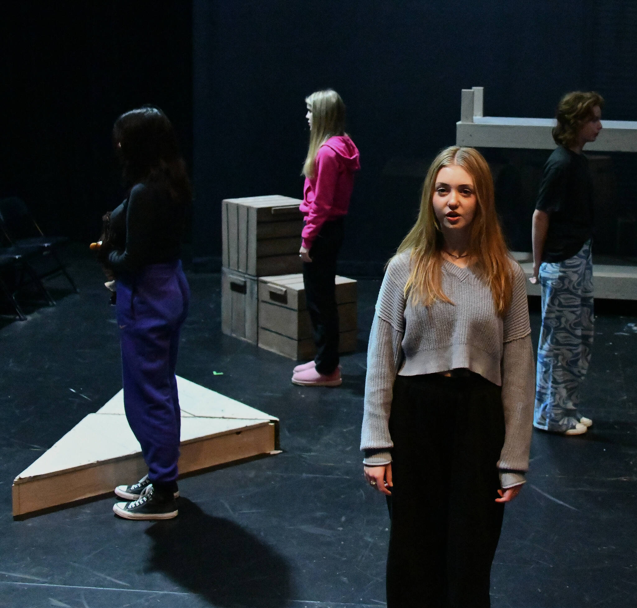 Mercer Island High School’s Paige Kirby faces front and is surrounded by Zoya Firasta, Brielle Gradek and Mia Vorkoper during a rehearsal of “And a Child Shall Lead.” Andy Nystrom/ staff photo