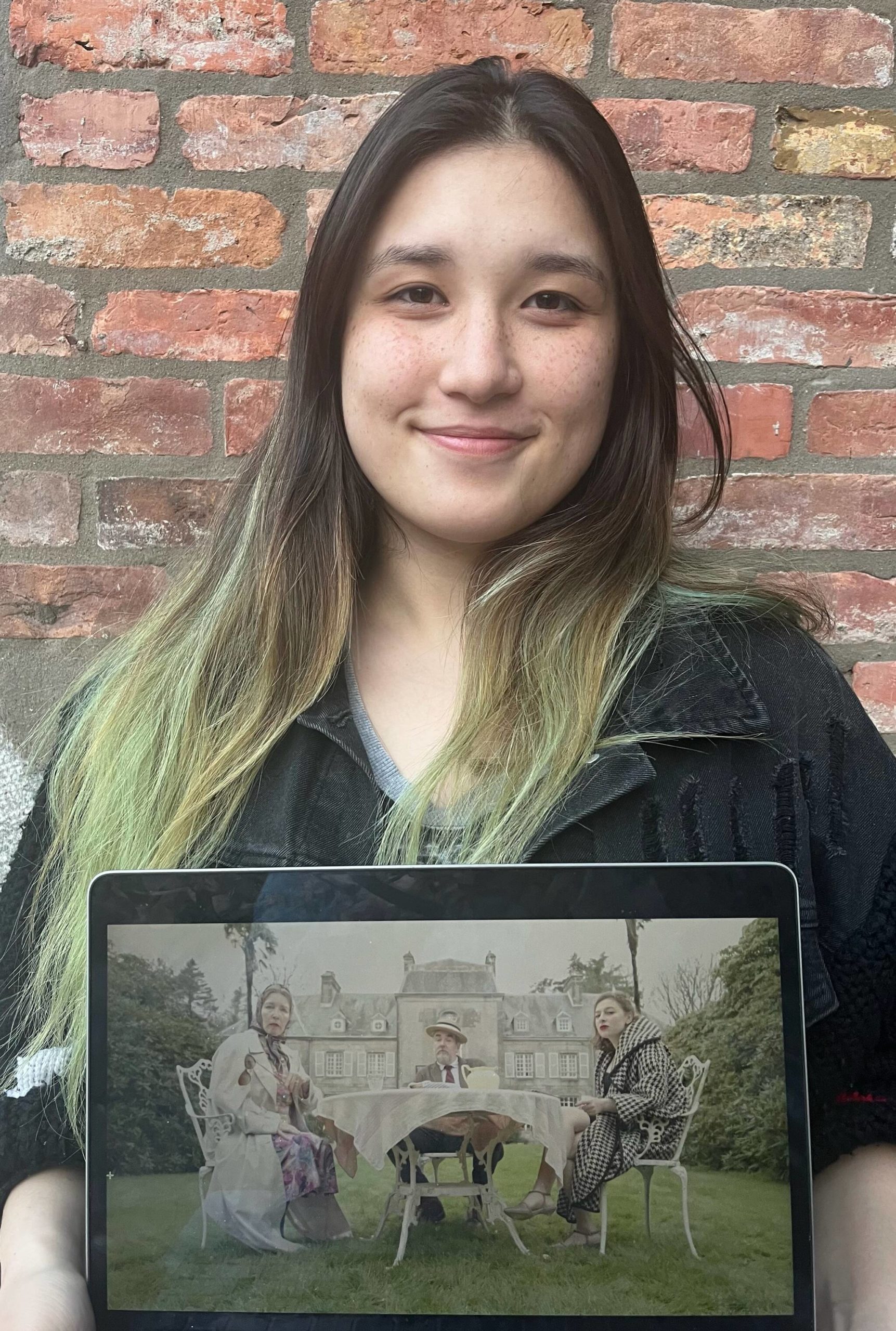 Mercer Islander Alex Isbell, who received a 2023 YoungArts competition prestigious finalist award for her short film, “J’Accucumber,” a World War II narrative absurdist satire. Here, she displays a still shot from the film. Courtesy photo