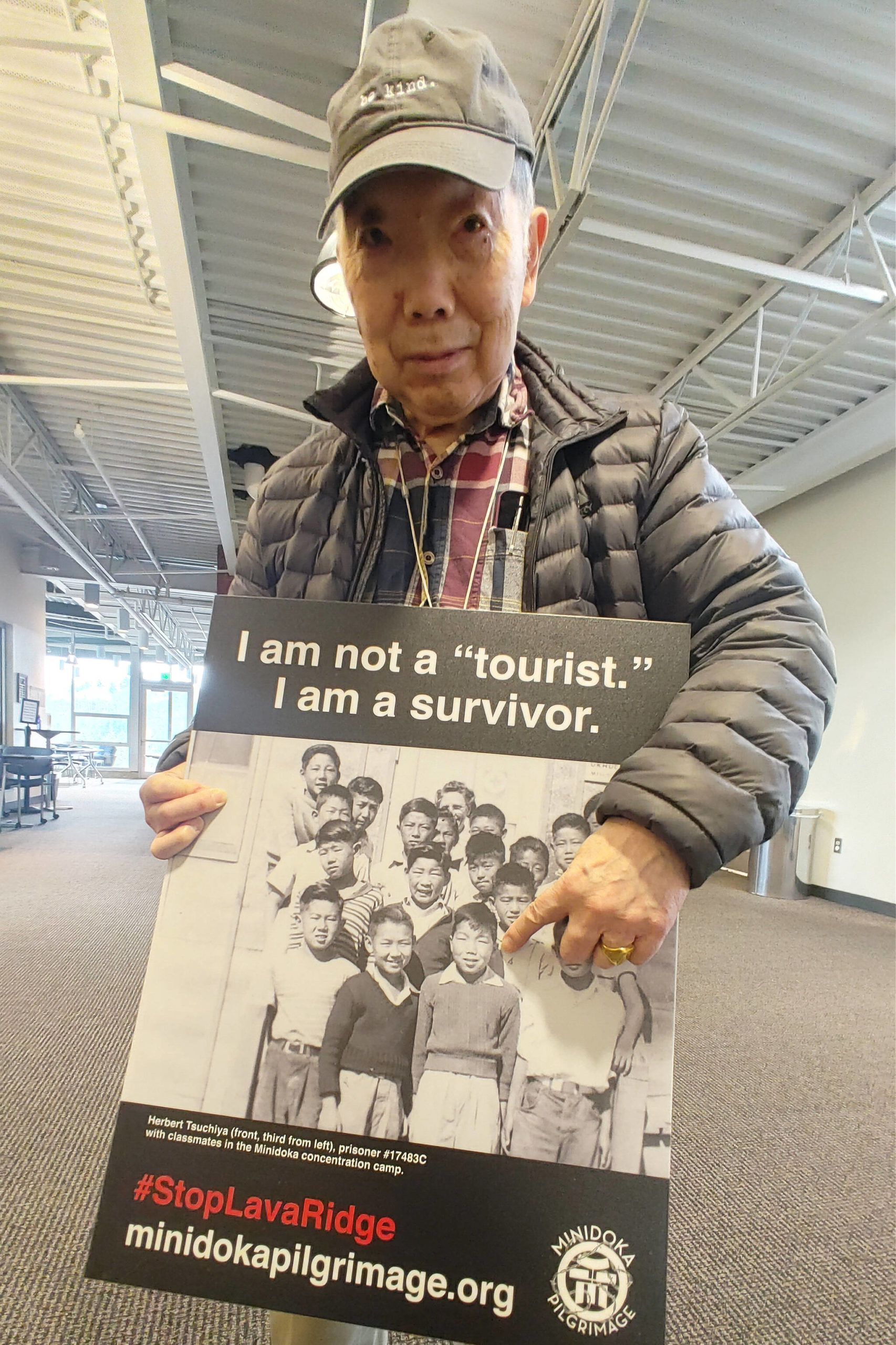 Mercer Island resident Herbert Tsuchiya points to a photo of himself while incarcerated at the Minidoka Japanese American internment camp in southern Idaho at age 10. Andy Nystrom/ staff photo