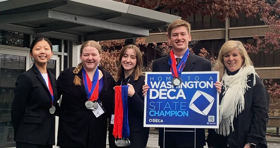 Mercer Island High School DECA students, from left to right, Jessica Xing, Ellie Sadlier, Julia Wilson and Andrew Howison along with instructor Jen McLellan. Photo courtesy of the Mercer Island School District