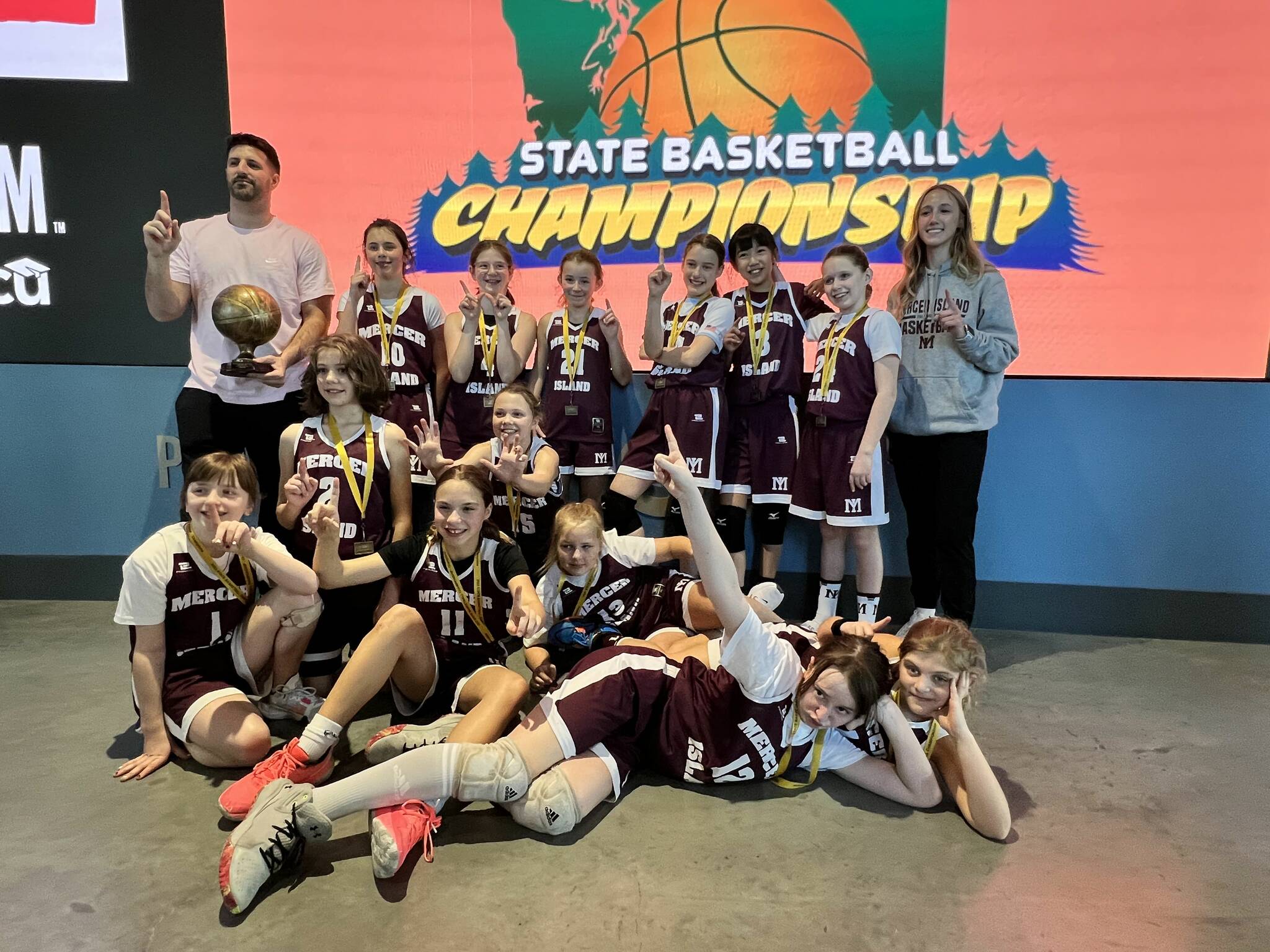 Fifth-grade girls state champs: Back row (standing): Coach Tony Locascio, Julia Gribble, Marlowe Eskridge, Claire Oberto, Maija McCune, Chloe Chen, Elsie Pierce and assistant coach Grace Shaddle; Floor: Margaret Shea, Aylwen Battersby, Sydney Munson, Lana Cuneo, Paige Anderson, Sophia Clark and Mackenzie Helman. Courtesy photo