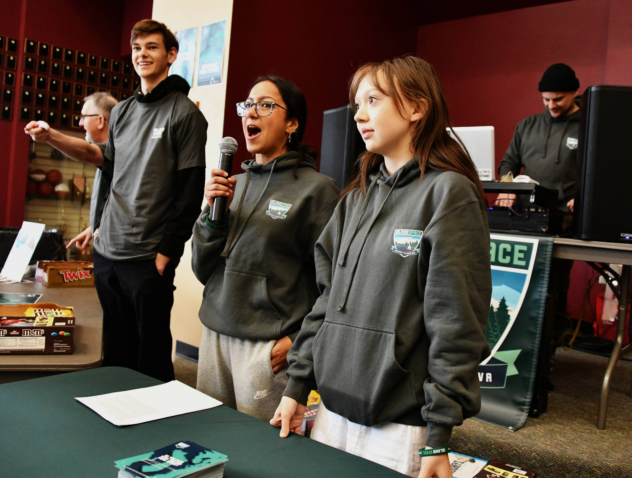 From left to right, Mercer Island Youth and Family Services school-based counselor Chris Harnish, Mercer Island High School sophomore Connor Wood, senior Libby Myers and sophomore Ren Evans and DJ Clint Kuper at the Island Space Lunch Jam on April 19 in the school commons. Andy Nystrom/ staff photo