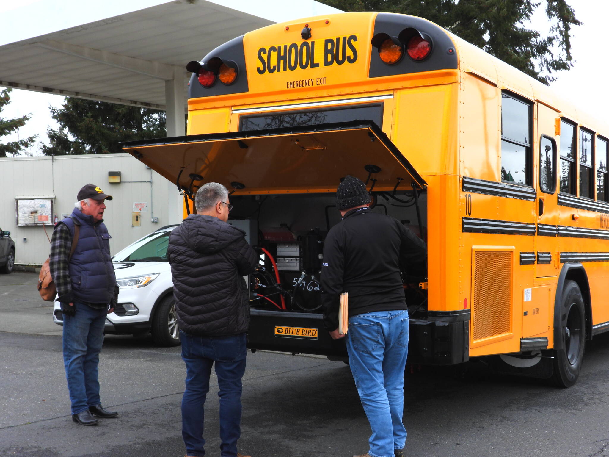 From left to right: Tom McGarry, Bryson sales and service employee who drove the electric bus to Mercer Island; Patrick Rock, Mercer Island School District’s director of transportation; and Rusty Mitchell, Bryson sales representative. Photo courtesy of the Mercer Island School District