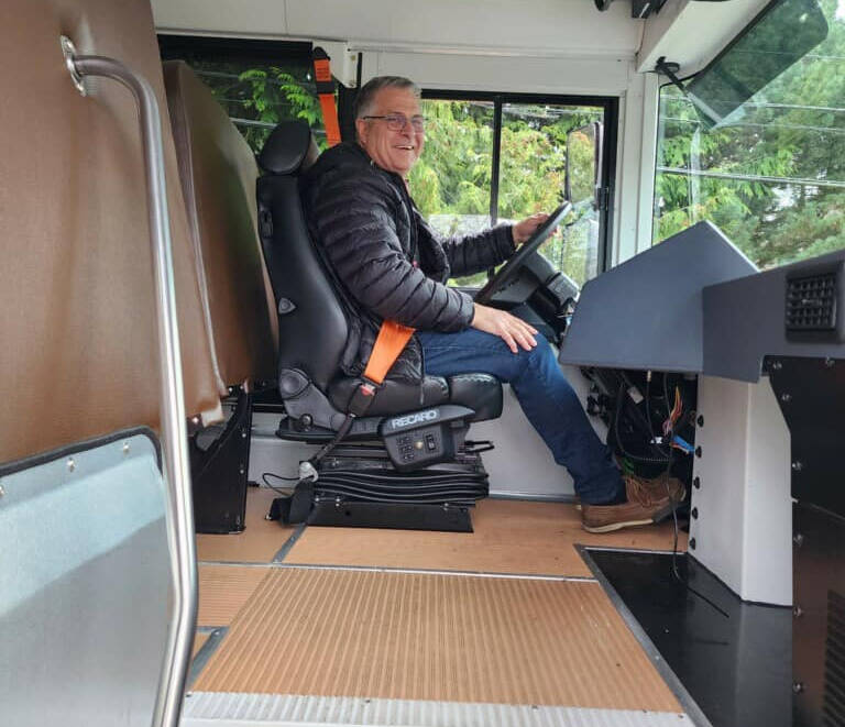 Mercer Island School District Director of Transportation Patrick Rock takes the new electric bus out for a test drive. Photo courtesy of the Mercer Island School District