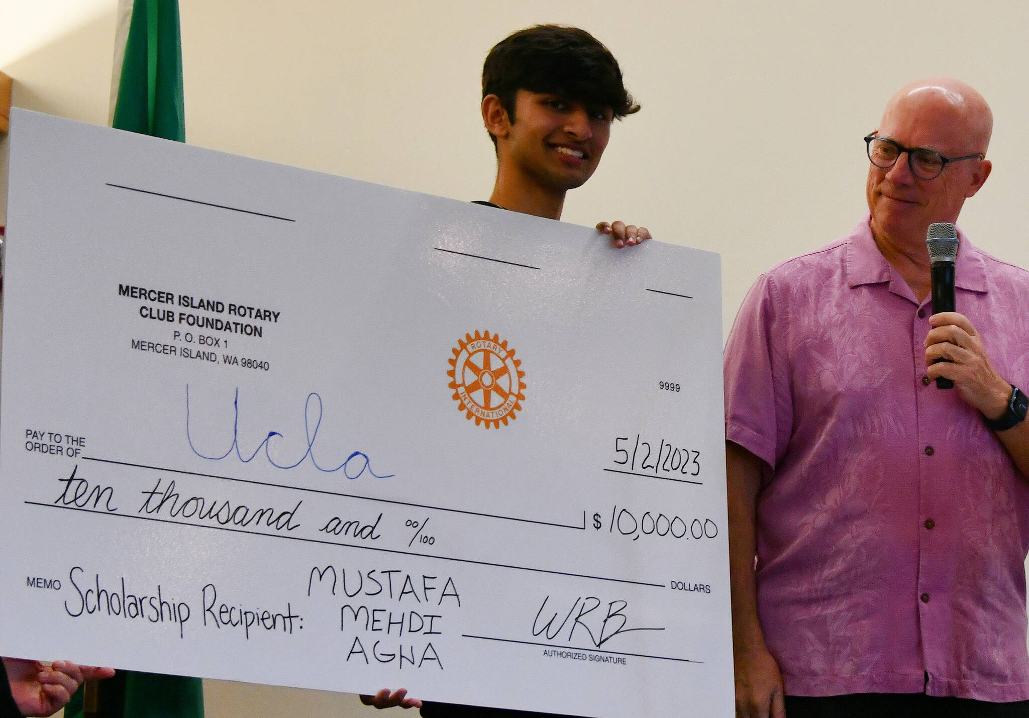 Mercer Island High School senior Mustafa Mehdi Agha received a $10,000 scholarship from the Mercer Island Rotary Club Foundation at its May 2 meeting at the Mercer Island Community and Event Center. Rotarian Wally Boos presented the award to Agha, who has officially committed to attend UCLA in the fall. Andy Nystrom/ staff photo