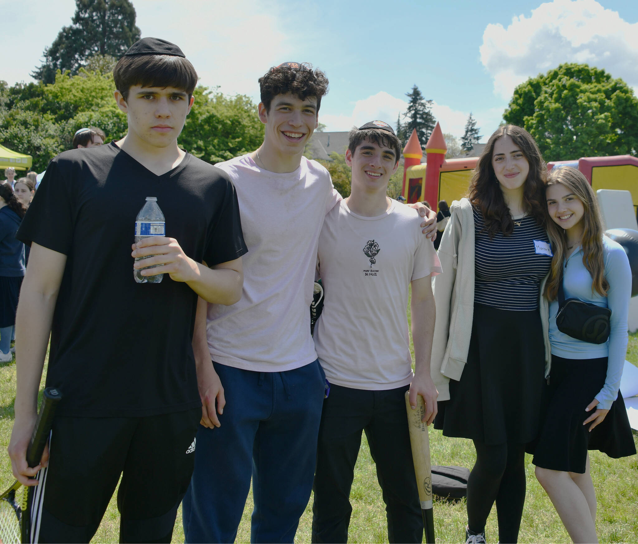 Northwest Yeshiva High School (NYHS) students, from left to right, Steven Rolan, Daniel Negrin, Yehonatan Rothstein, Merav Frank and Emma Almo participate in an all-local Jewish day school Lag B’Omer celebration on May 9 at Aubrey Davis Park on Mercer Island. Lag B’Omer is a Jewish holiday that occurs between Passover and Shavuot, and it is customary to listen to and play music, barbecue, play sports and have fun. For the first time in Seattle history, six Jewish day schools in the greater Seattle area celebrated together. The schools were: NYHS from Mercer Island (9-12), Jewish Day School from Bellevue (K-8) and Seattle’s MMSC Day School (K-8), Seattle Hebrew Academy (K-8), Seattle Jewish Community School (K-8) and Torah Day School/Derech Emunah (K-12). Andy Nystrom/ staff photo