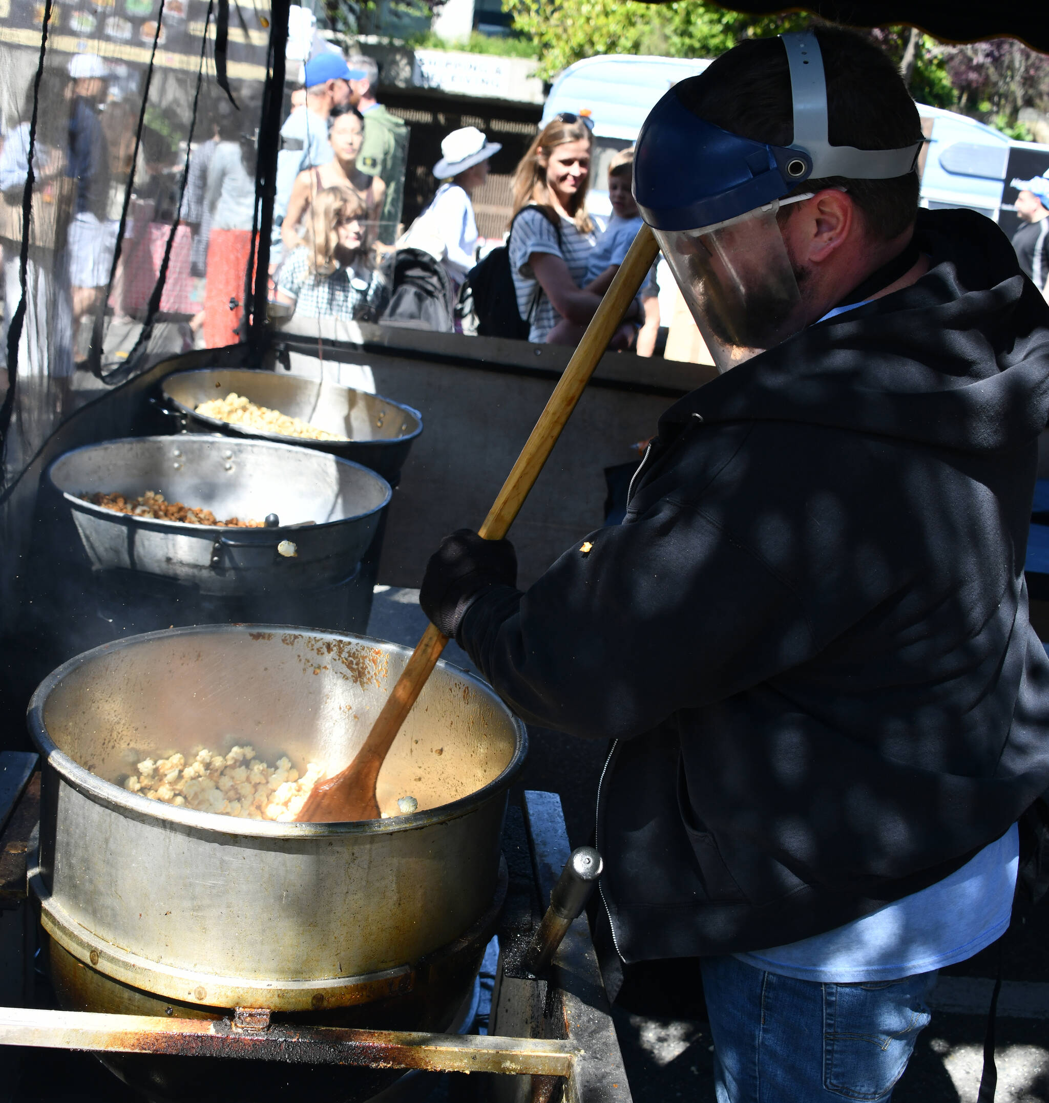 Brantly Webber pops kettle corn at the Mercer Island Farmers Market on June 4. Andy Nystrom/ staff photo