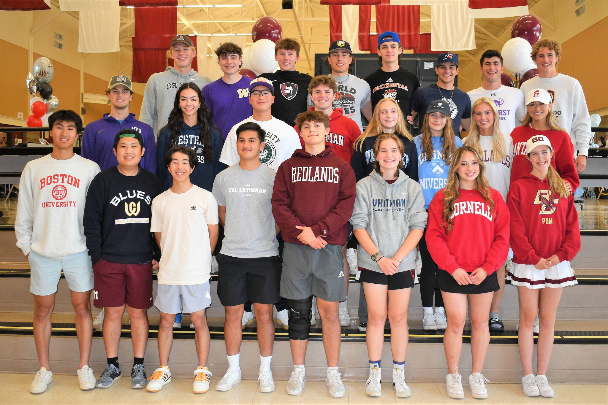 Pictured are 24 of the 29 Mercer Island High School senior athletes who signed their national letters of intent at the school on June 6. Photo courtesy of Kym Otte