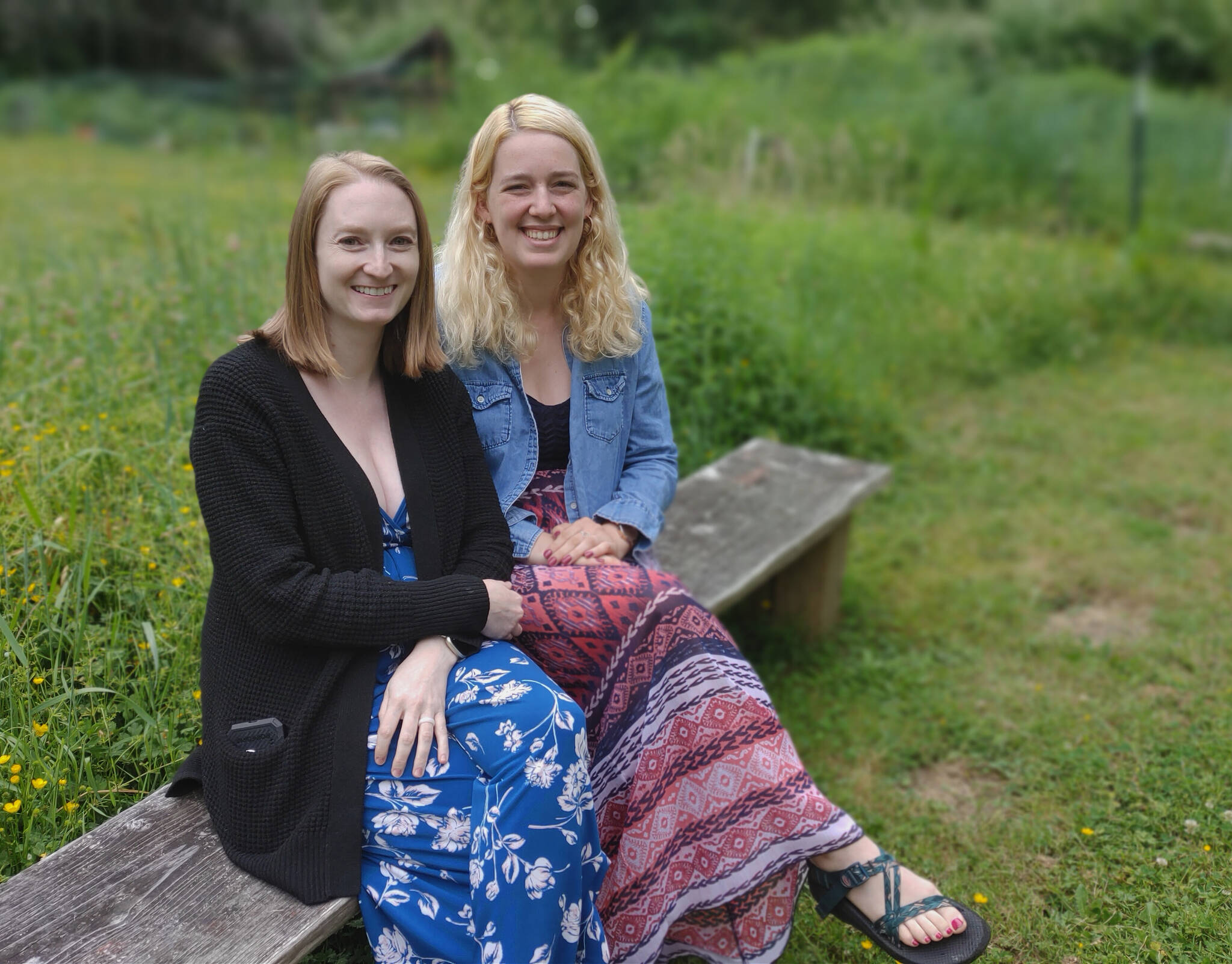 Stroum Jewish Community Center’s Lisa Williams, left, and Aliza Glatter relax in the campus’ Kesher Community Garden. Andy Nystrom/ staff photo