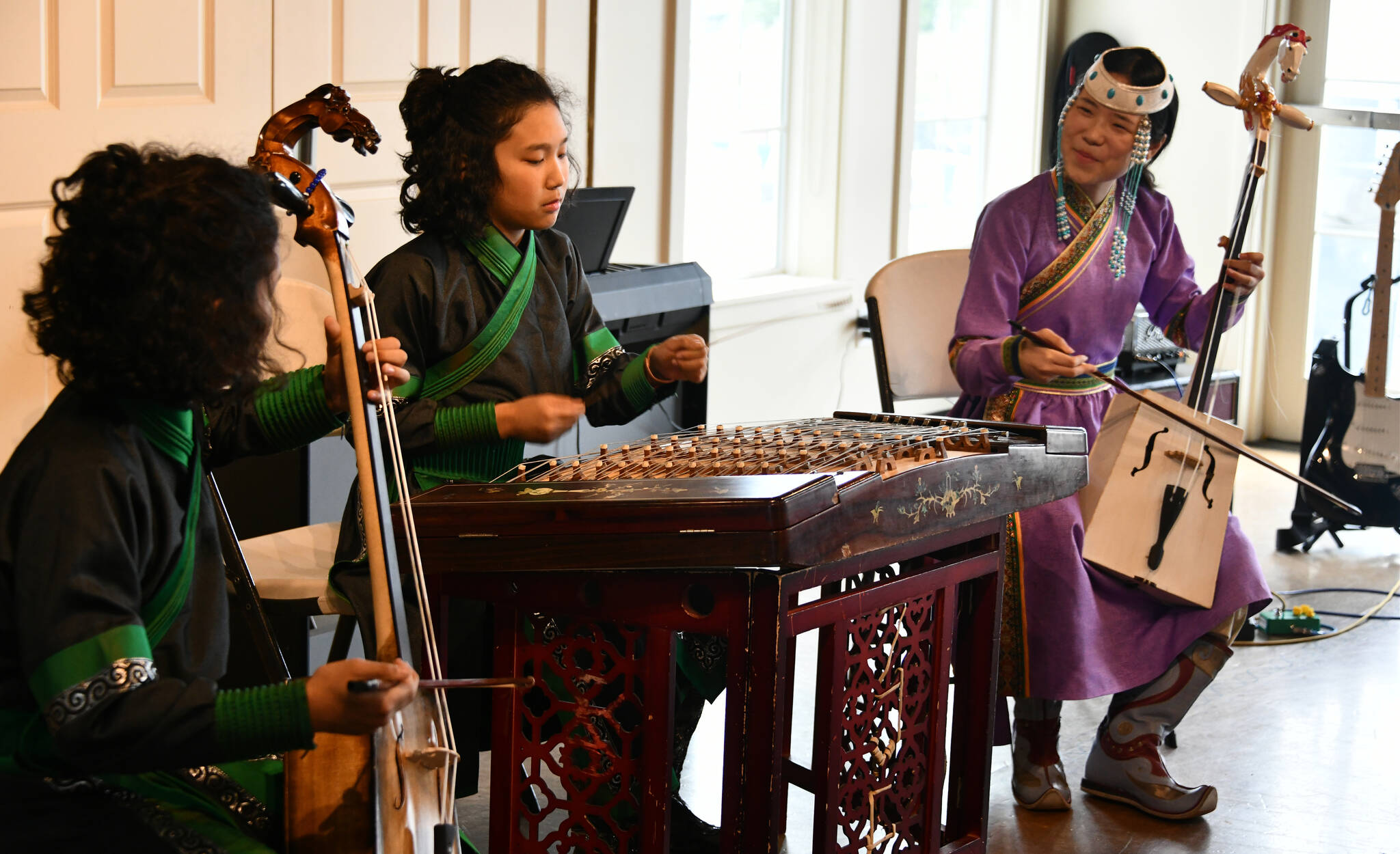 The Mercer Island-based ZJE Mongolian Music Ensemble — Temuujin, Temuulen and Anu-Ujin Batbaatar — perform a traditional Mongolian tune at the recent AANHPI (Asian American, Native Hawaiian and Pacific Islander) student showcase at the Newport Yacht Club in Bellevue. ZJE will perform a free concert from 7-8 p.m. on July 21 at the Old Fire House Teen Center, 16510 NE 79th St., Redmond. “Immerse yourself in the vibrant sounds of traditional Mongolian music, where captivating rhythms and soul-stirring vocals will transport you to a world of cultural richness,” reads a press release. Seats are limited. Andy Nystrom/ staff photo