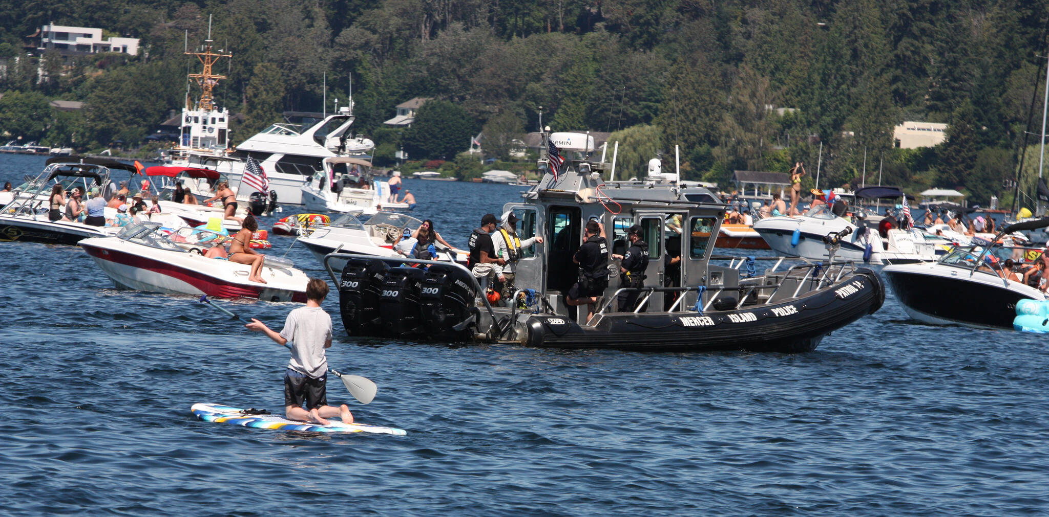 A Mercer Island Police Department Marine Patrol unit surveys the scene on Lake Washington during the Seafair Weekend festival on Aug. 7, 2022. Andy Nystrom/ staff photo