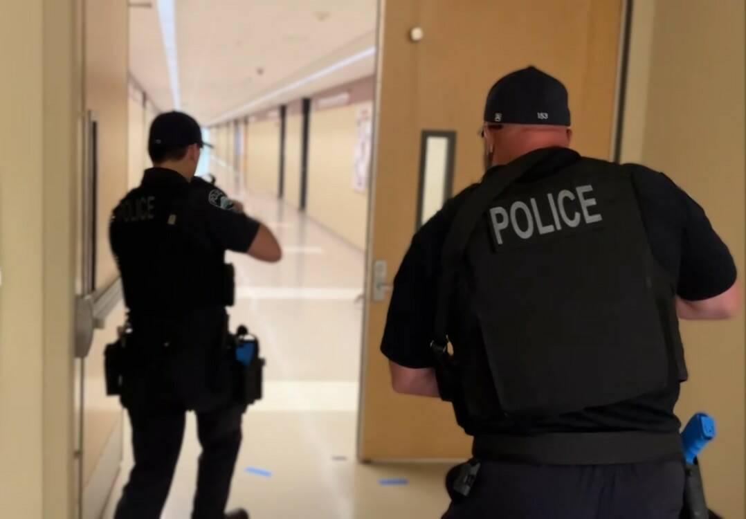 Mercer Island Police Department Commander Mike Seifert, right, and a fellow officer participate in active shooter training and emergency drills at Mercer Island High School in July. Photo courtesy of Mike Seifert
