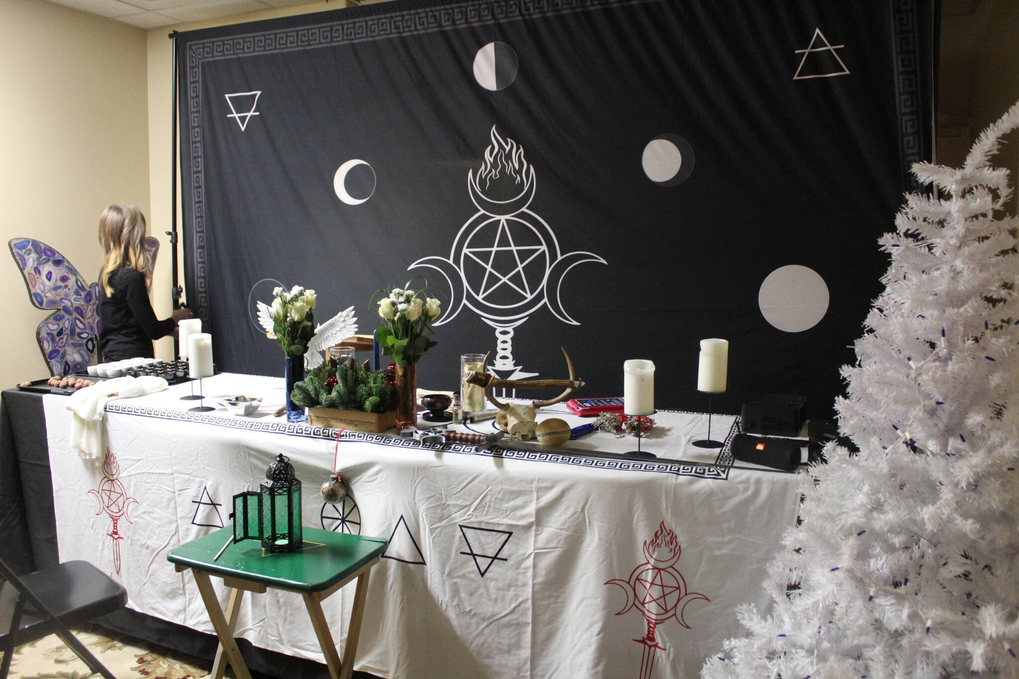 Leading up to the Yule rituals, decorations were put up and altars were erected. The coven's backdrop centers its personal sigil, the lunar cycle and elemental symbols. Photo by Bailey Jo Josie/Sound Publishing.