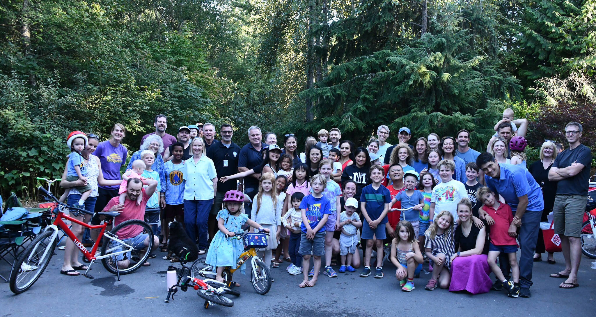 Mercer Islanders gather in the Ellis Pond neighborhood along with Mayor Salim Nice, Mercer Island Police Department Chief Ed Holmes and the city’s emergency management leader Amanda Keverkamp at a National Night Out gathering on Aug. 1. Islander Jordan Naftolin organized this robust event in his area. The national campaign promotes police-community partnerships and focuses on crime prevention and resident connectedness. Story to come. Andy Nystrom/ staff photo