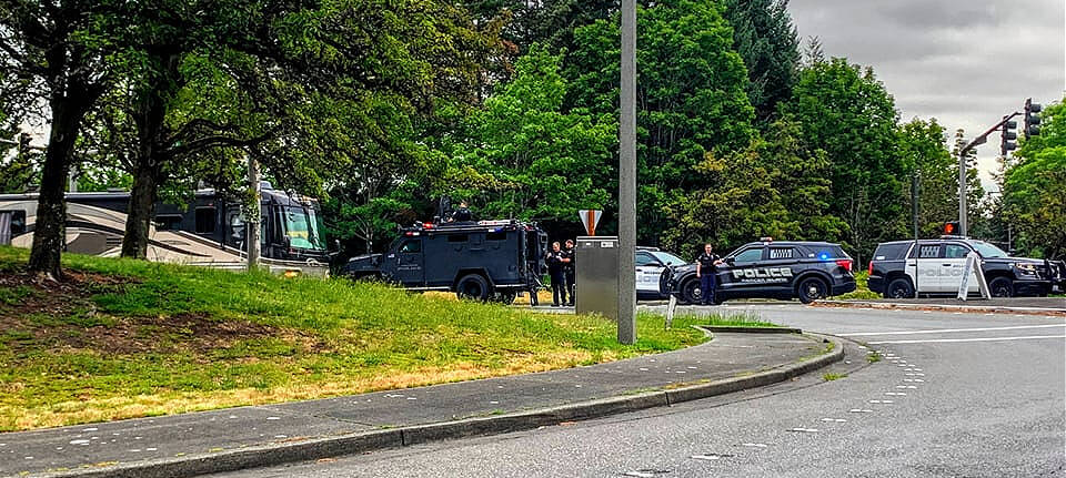 Police officers survey the scene at the intersection of East Mercer Way and Southeast 36th Street on Mercer Island where an abandoned gunshot-damaged motorhome was located on Aug. 8. Photo courtesy of the Mercer Island Police Department