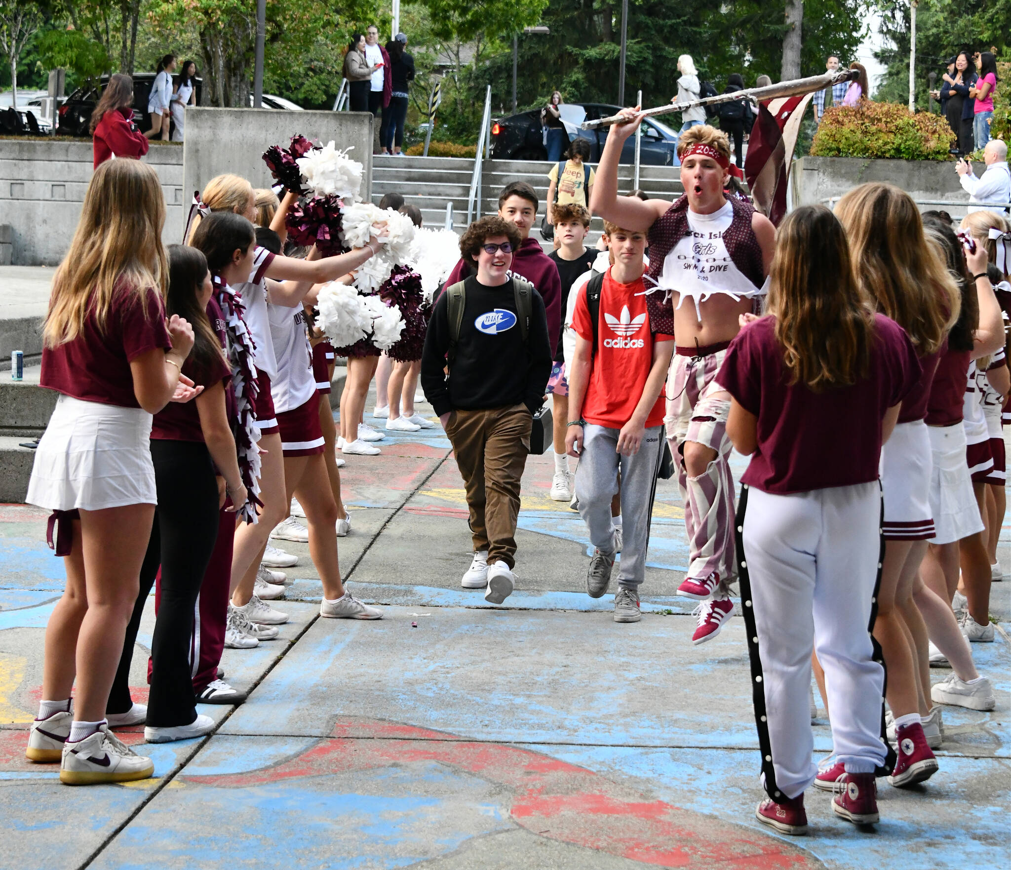 Members of the Mercer Island High School drill team and drum corps along with other students welcome ninth-graders onto campus on the first day of school on the morning of Aug. 30. Andy Nystrom/ staff photo
